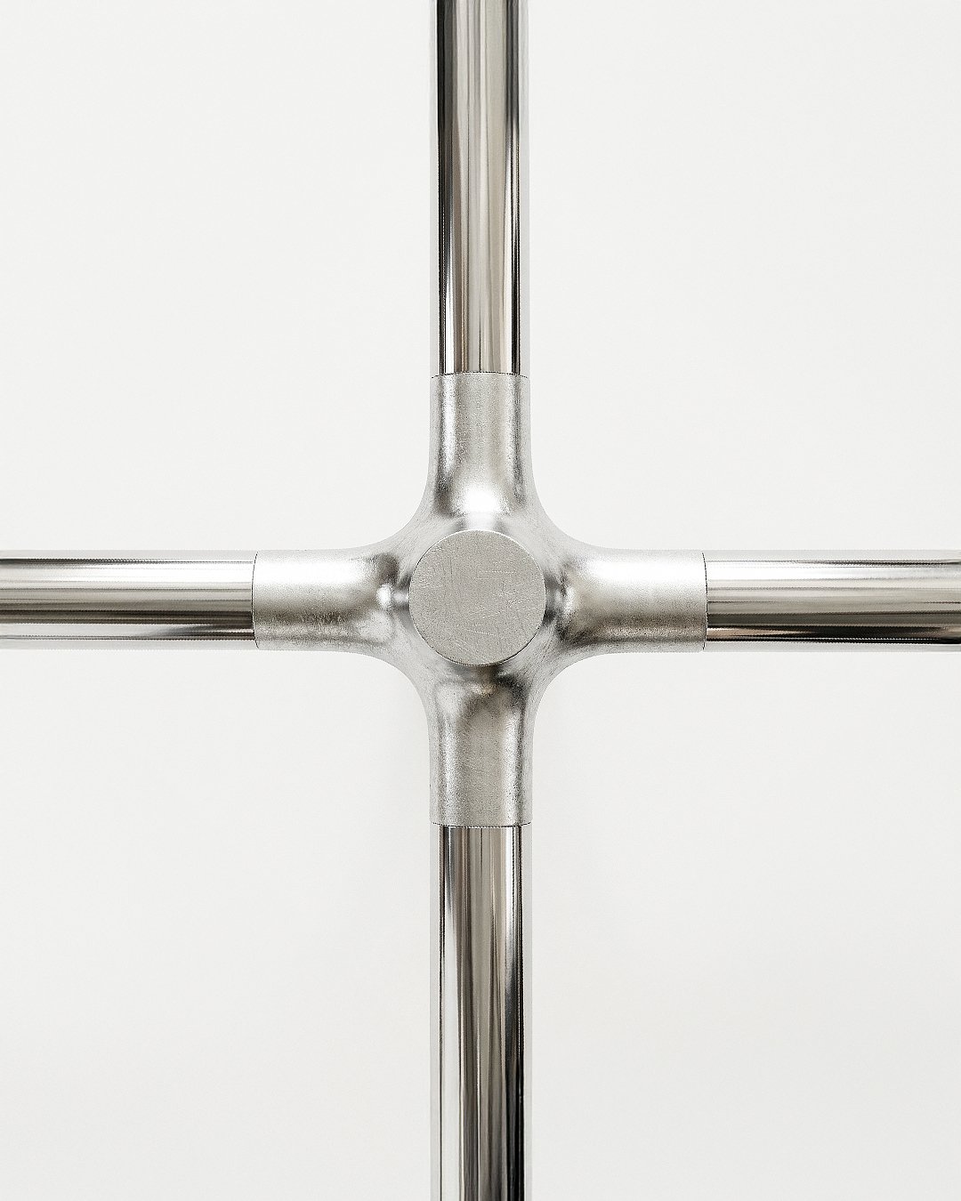 Knuckle Bones by Andrew Roberts modular shelving system featuring cast joint connectors, laser-cut steel tubing, and press-fit components arranged in a configurable structural storage layout.