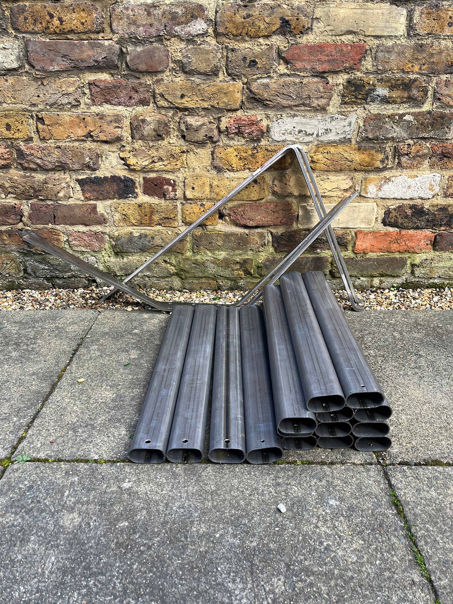The HMG Chair by Andrew Roberts is an outdoor lounge chair defined by its clarity of structure and material restraint. Using 'off the shelf' components, the chair reduces fabrication to a minimum while remaining distinctive.