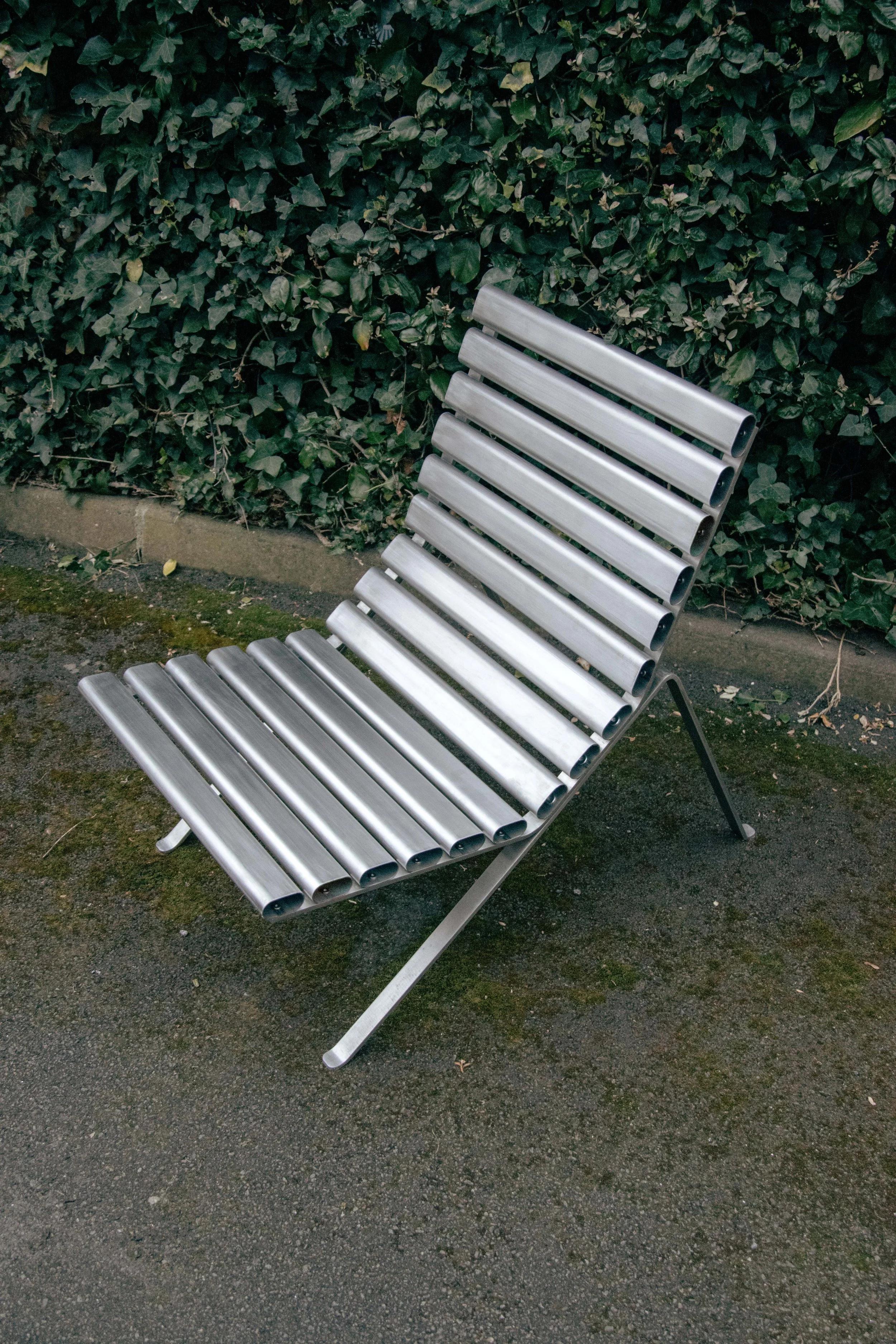 The HMG Chair by Andrew Roberts is an outdoor lounge chair defined by its clarity of structure and material restraint. Using 'off the shelf' components, the chair reduces fabrication to a minimum while remaining distinctive.