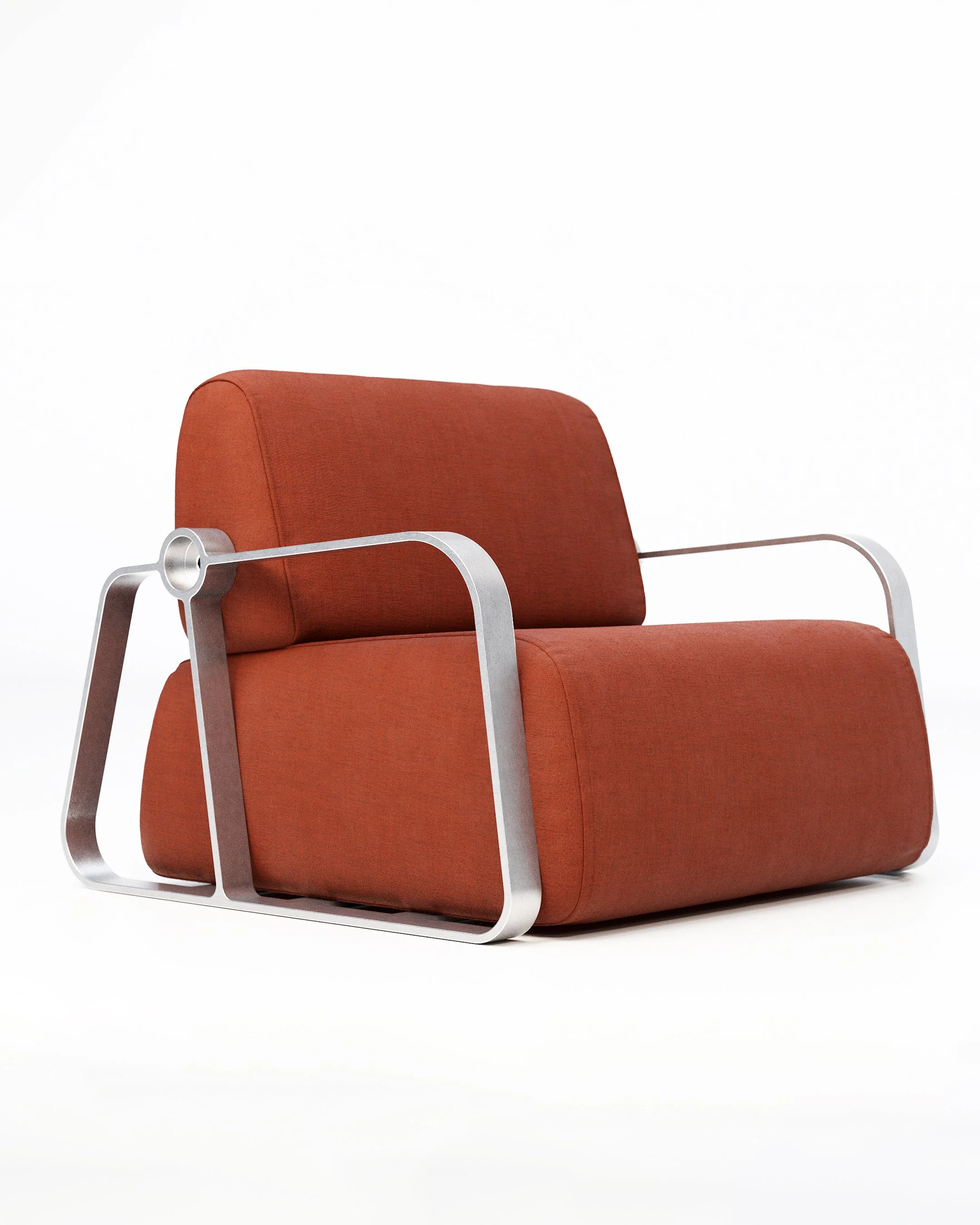 Putney Chair by New Zealand designer Andrew Roberts — a contemporary lounge chair combining soft moulded foam upholstery with a cast aluminium frame and armrests, designed for comfort, durability, and modern interior spaces.