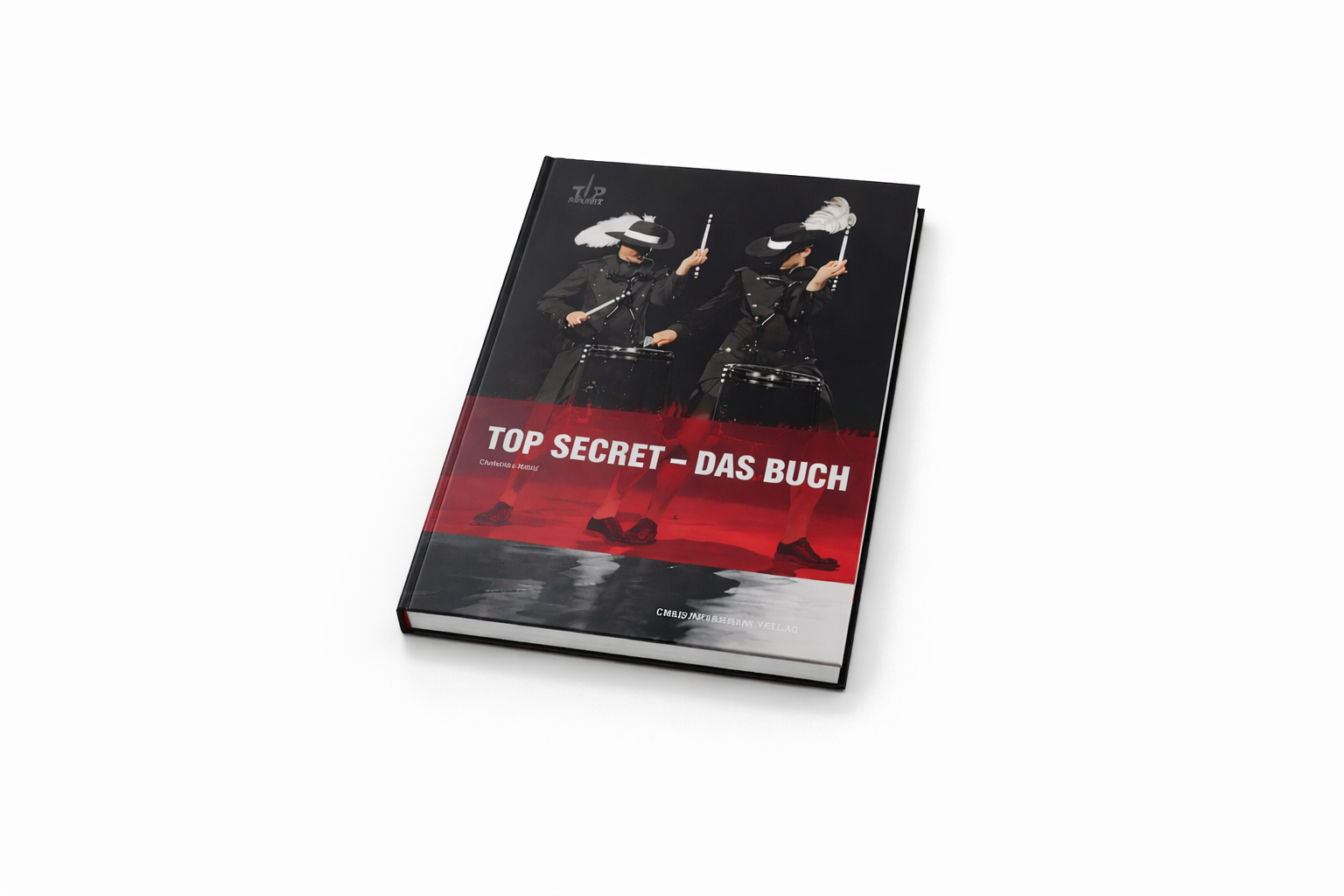 Buch mit Titel 'Top Secret - Das Buch' auf weißem Hintergrund, zeigt zwei Musikerinnen in schwarzen Kostümen mit schwarzen Hüten, die Schlagzeuge spielen.