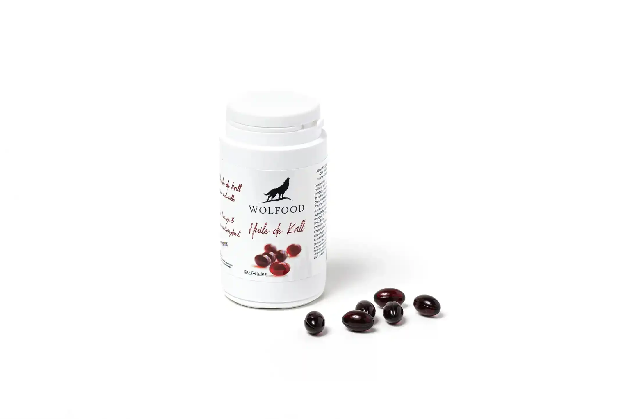 Une bouteille blanche de complément alimentaire Wolfood avec des gélules rouges en devant.