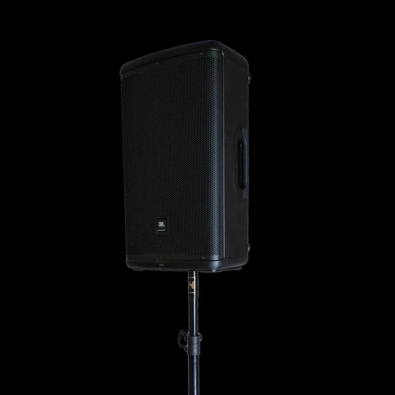 JBL EON715 powered PA speaker mounted on a tripod stand