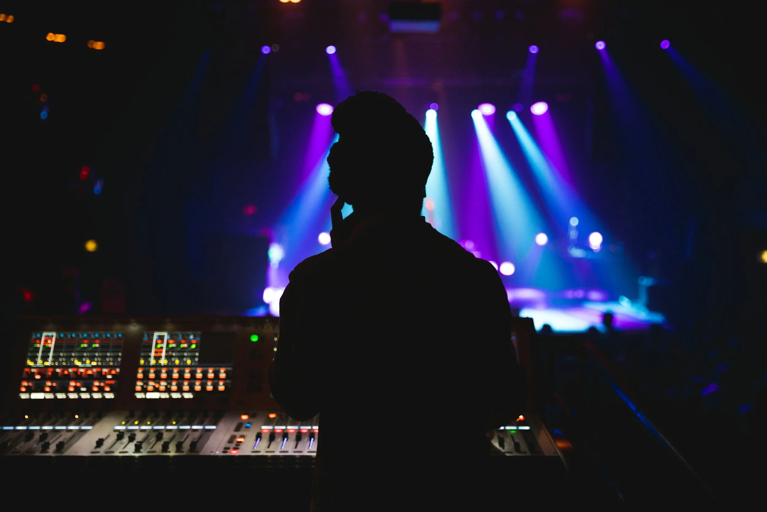 Audio technician managing a professional sound setup during a live event