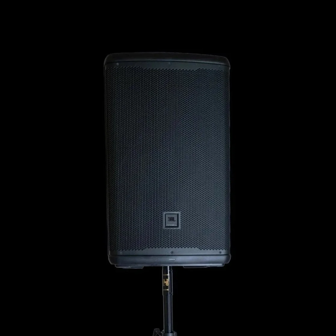 JBL EON715 professional powered speaker on a stand