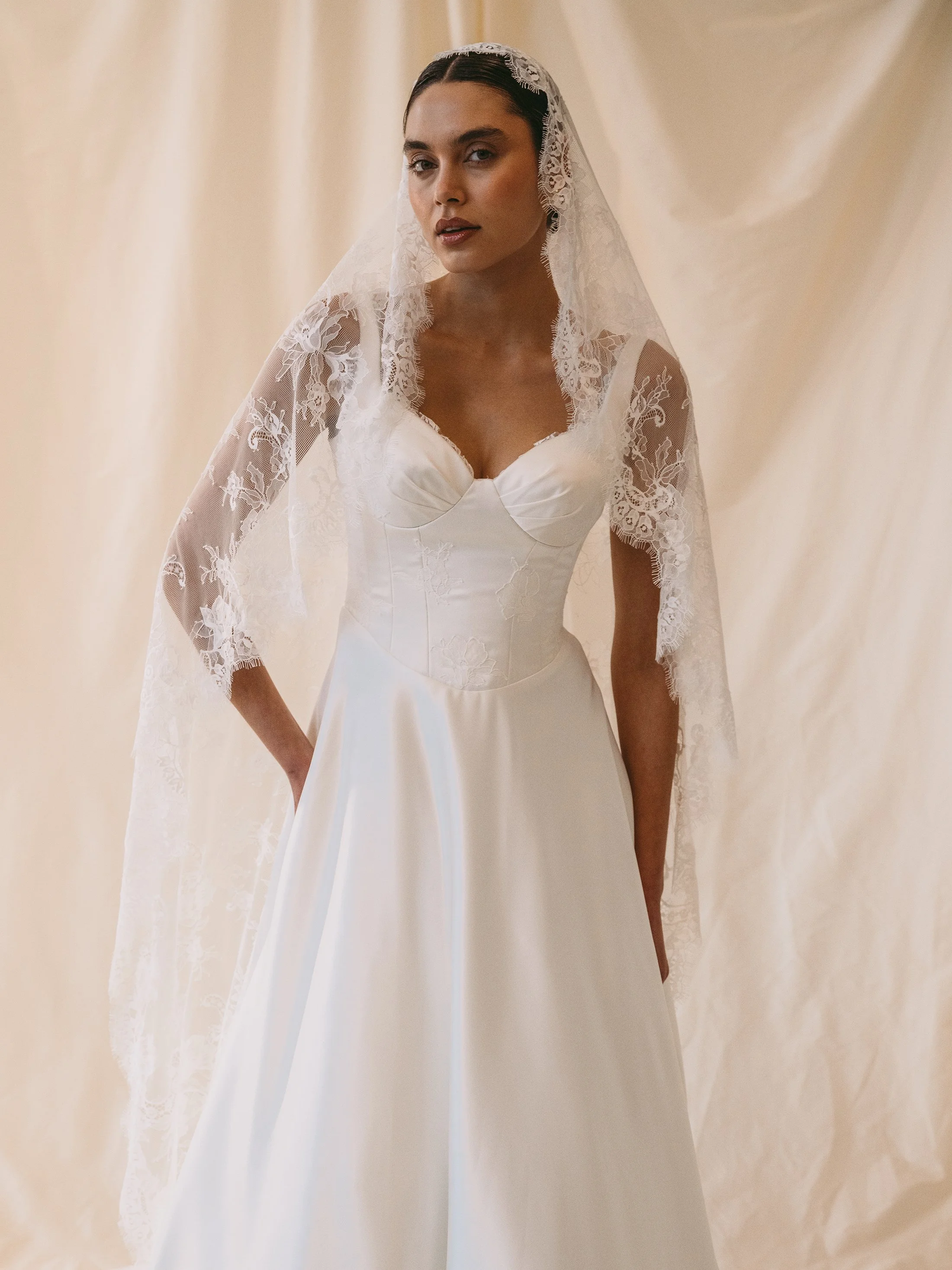 modern-satin-wedding-dress-with-mantilla-lace-veil.jpg