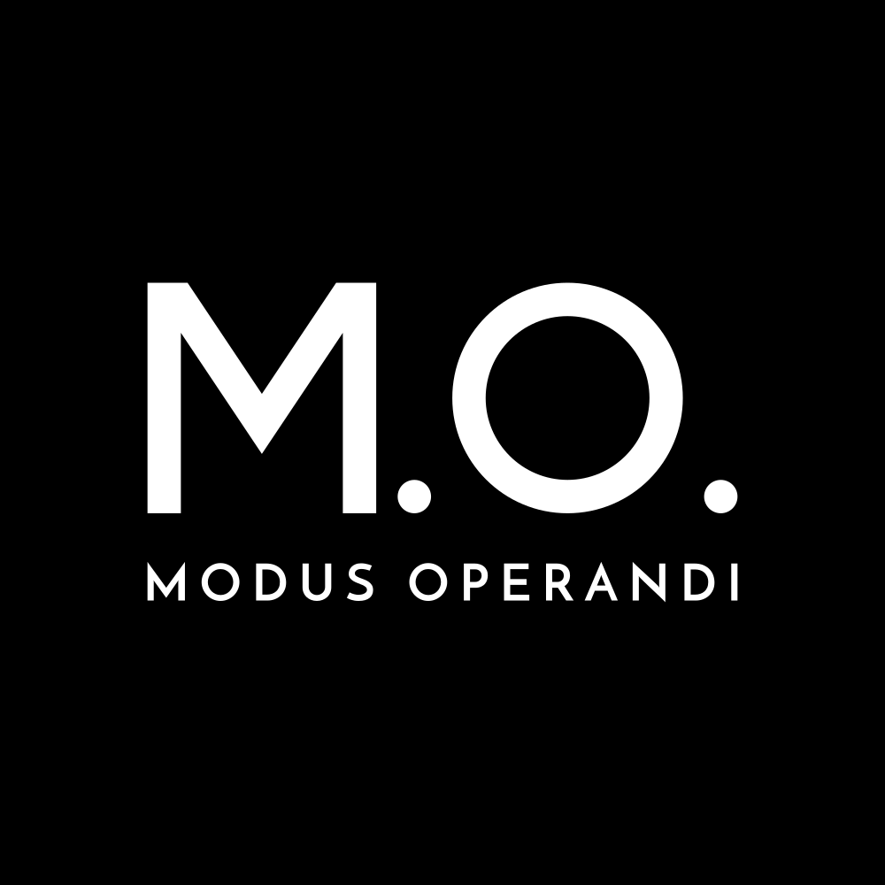 Logo with large white letters 'M.O.' and smaller text 'Modus Operandi' on a black background.