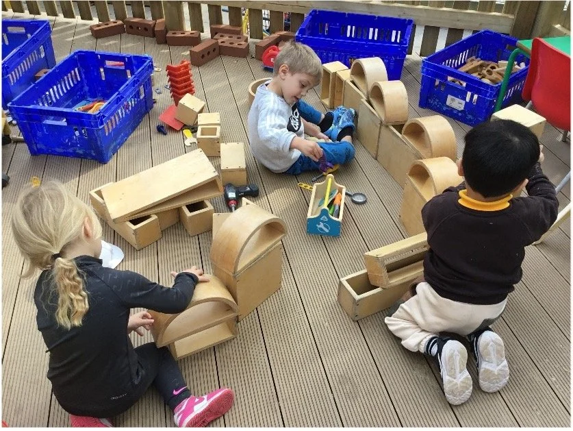 children-playing-new-toys-decking.jpg
