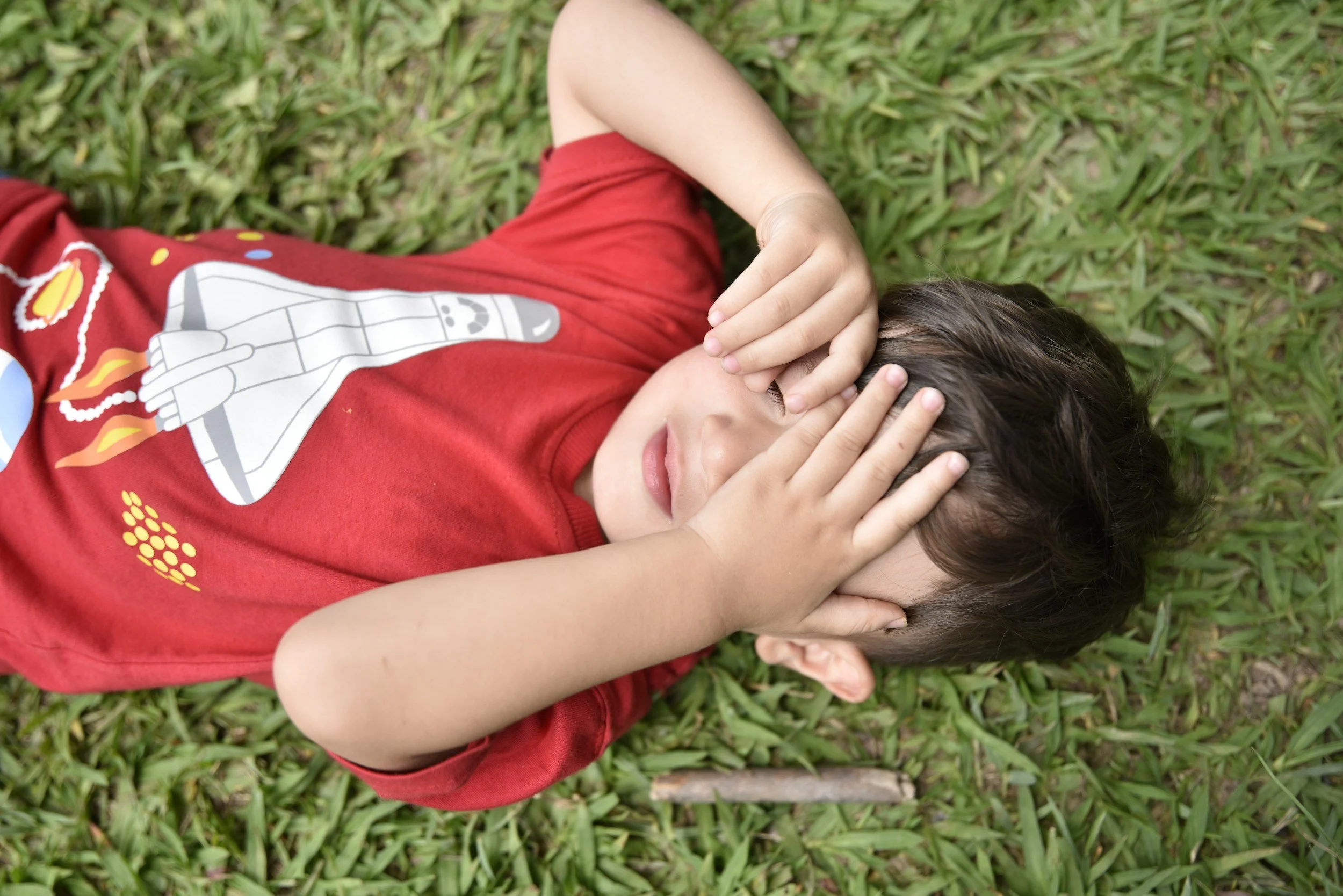 Child holding a toy during a therapeutic play assessment activity