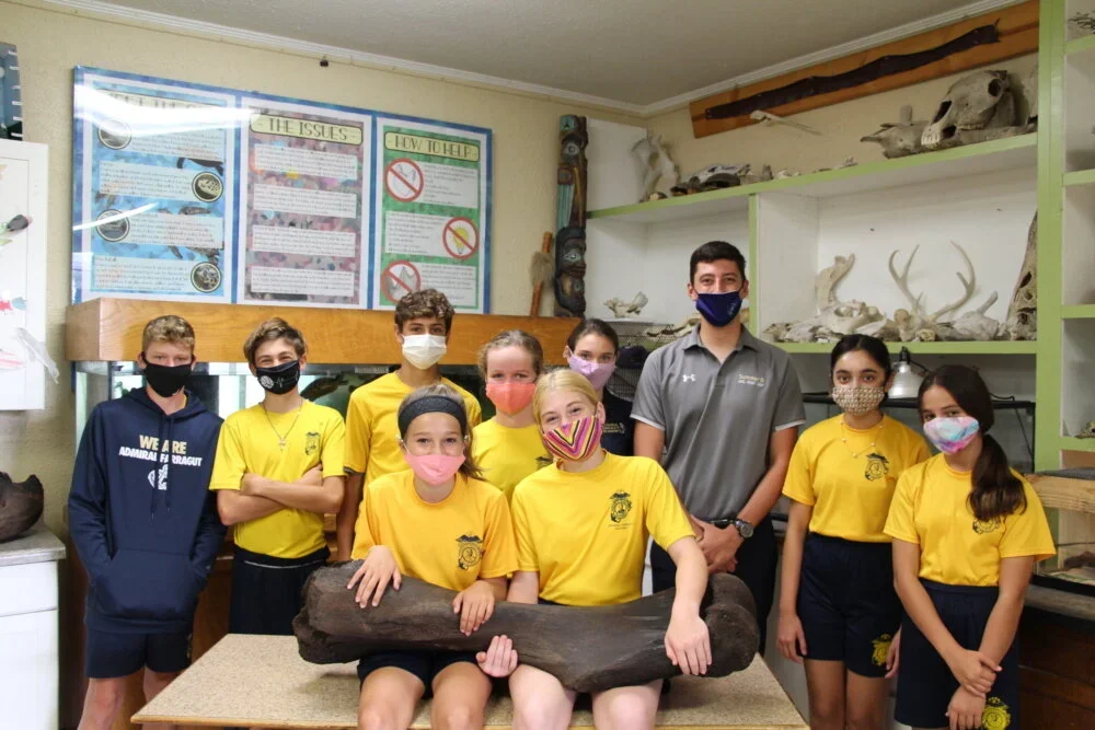 Lower School Science Teacher Henry Sadler finds massive mammoth bone while diving