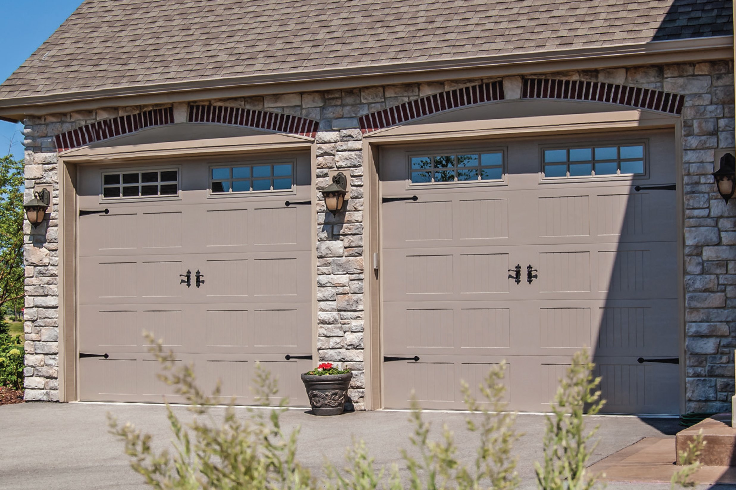 Two Stamped Carriage House Garage Carriage Doors on Stone House