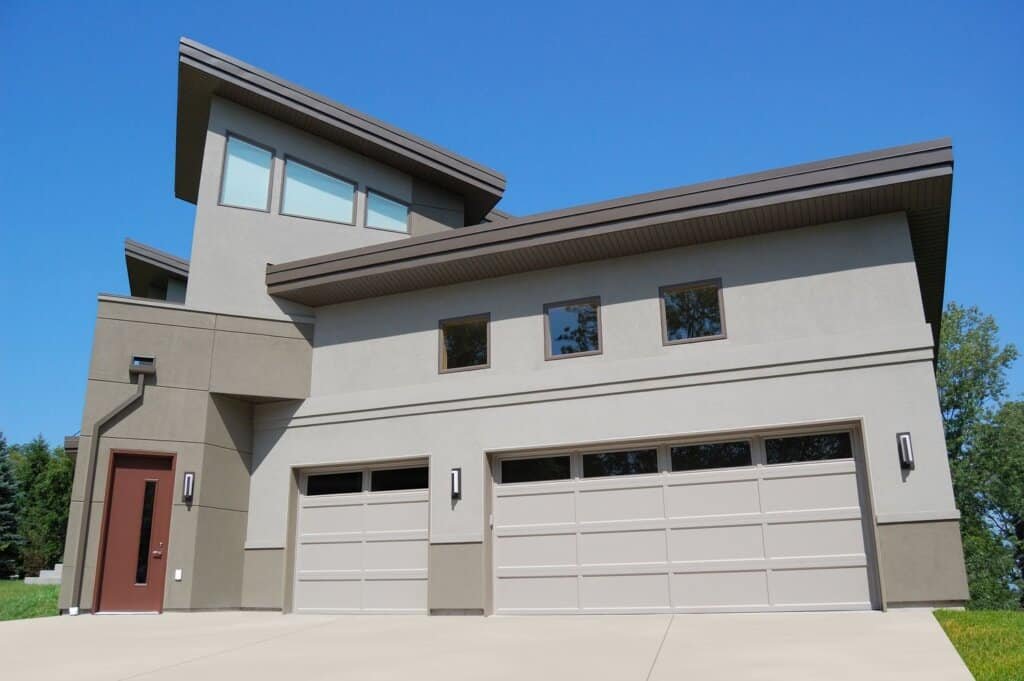 Two Recessed Panel Garage Doors on Two Story House