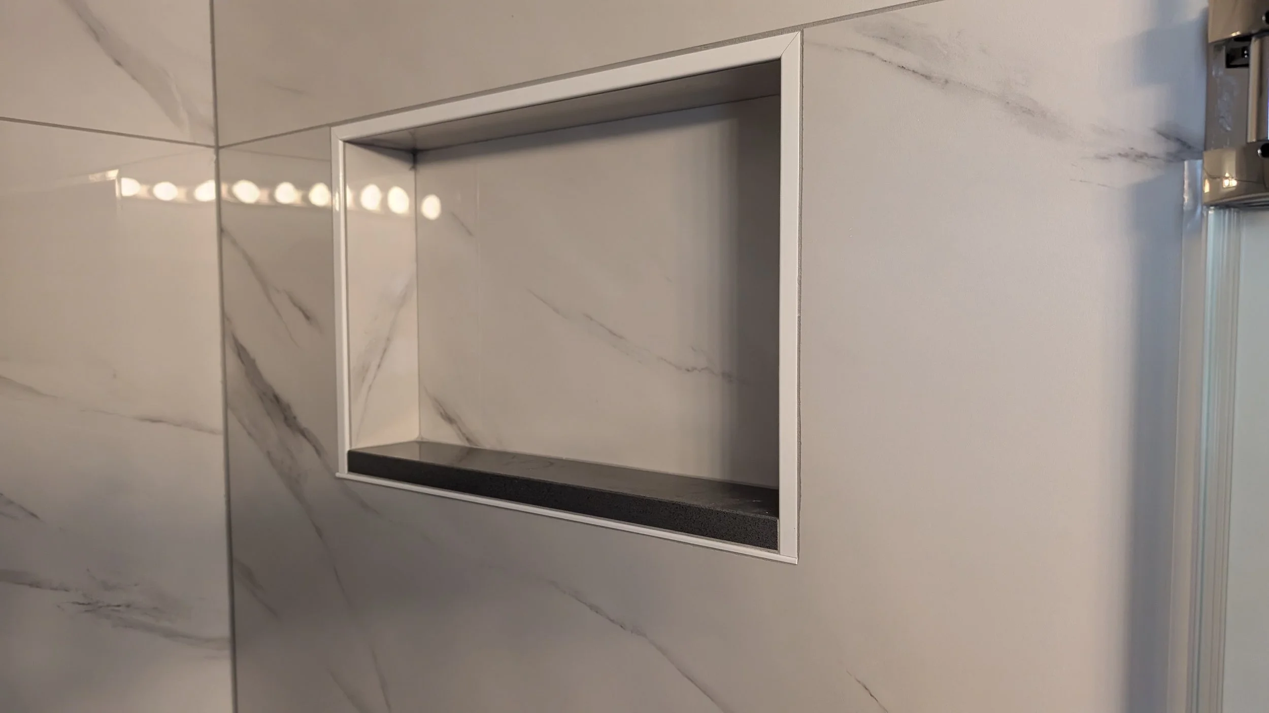 Walnut-hills-small-shower-large-tile-niche.jpg