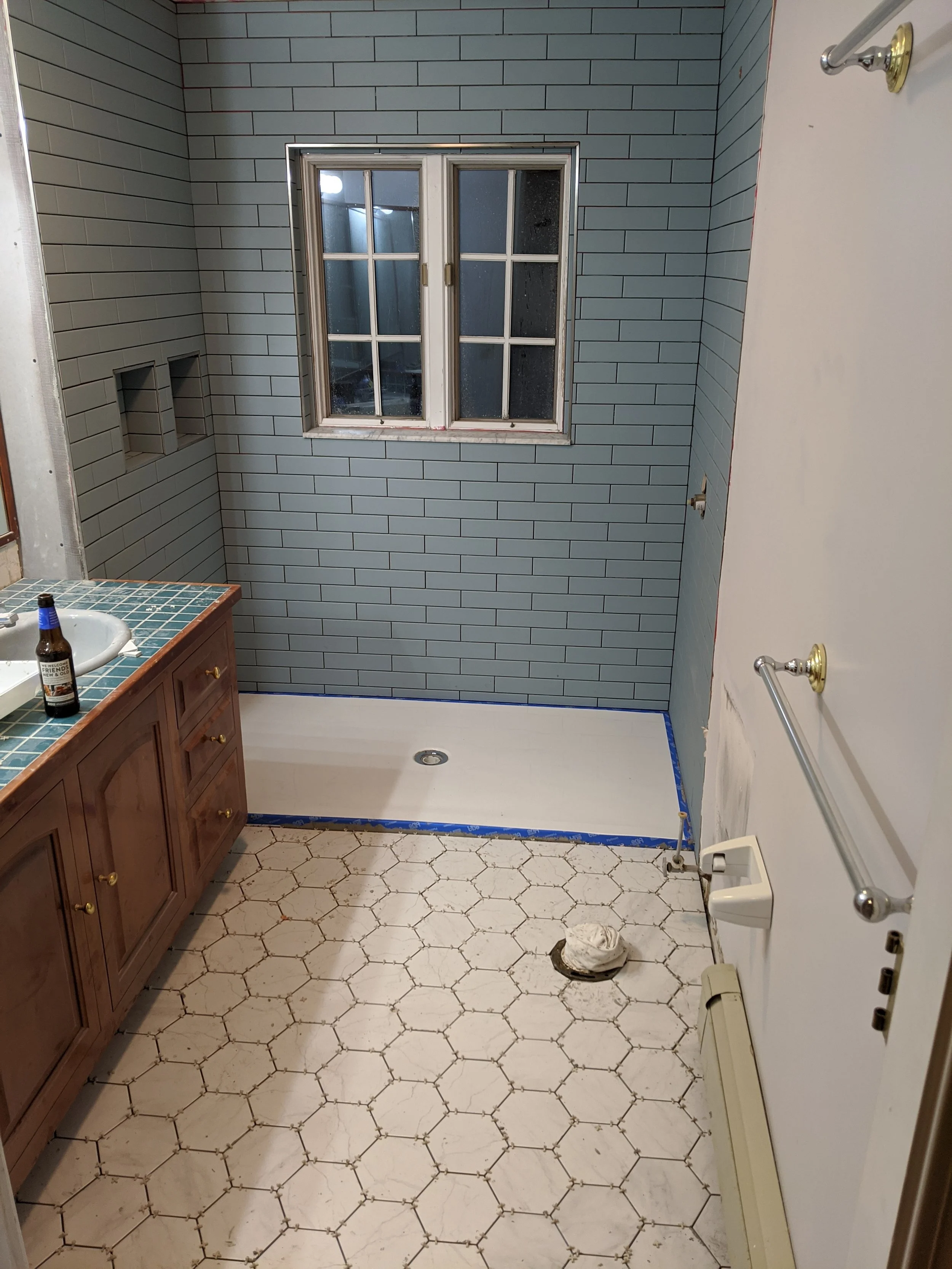 Family-master-bathroom-renovation-floor-tile.jpg
