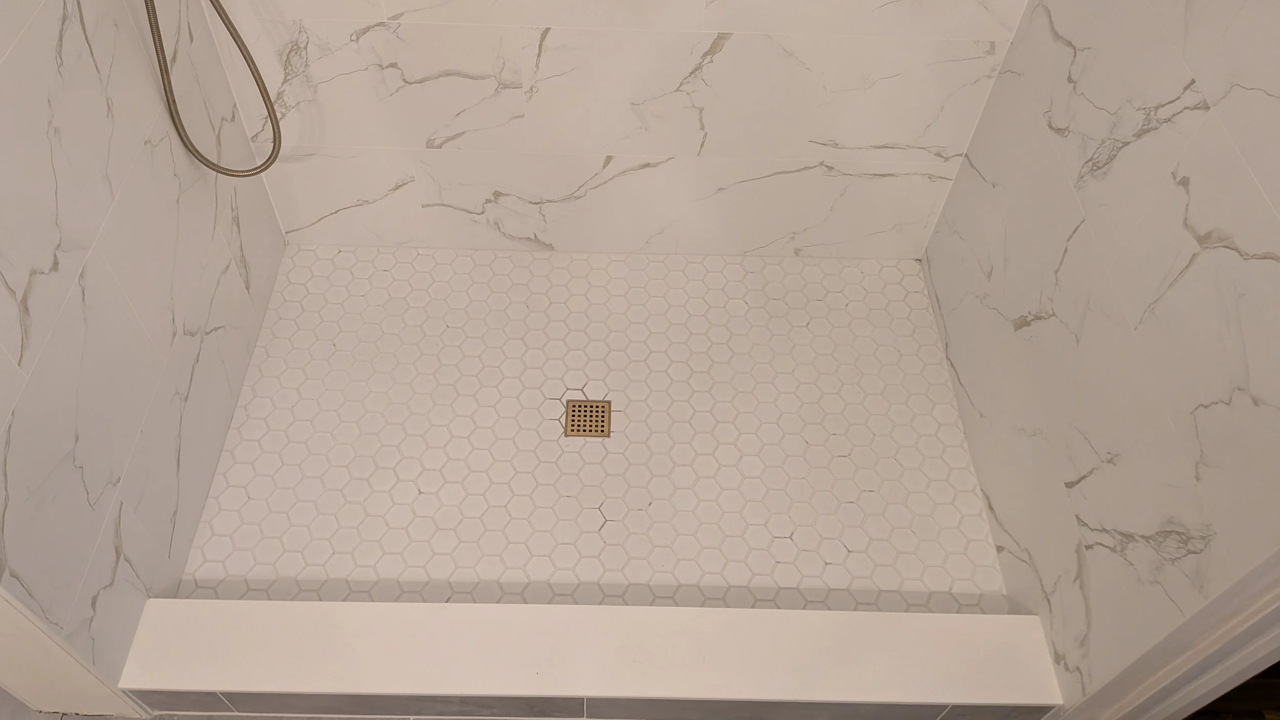 OTR-Cincinnati-OH-condo-master-bathroom-hex-floor-tile.jpg