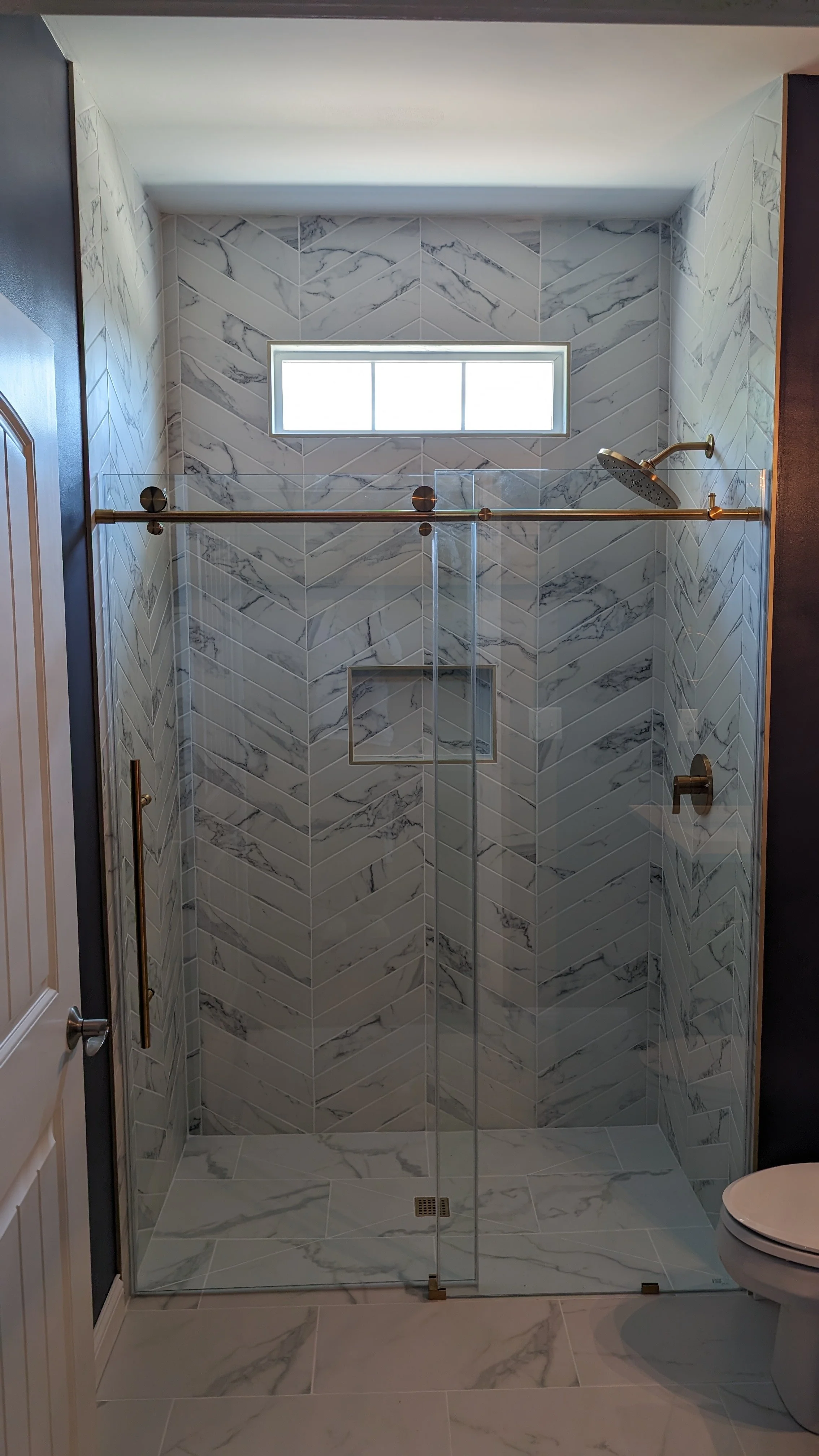 Loveland-bathroom-renovation-complete-curbless-shower-brushed-gold.jpg