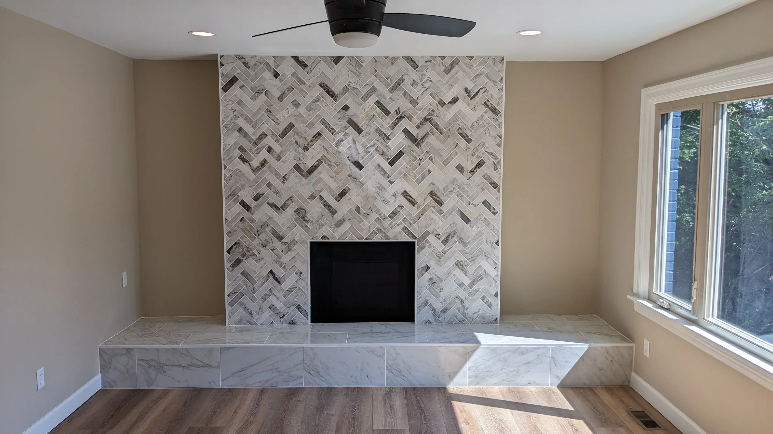 Madeira-office-renovation-herringbone-fireplace-tile.jpg