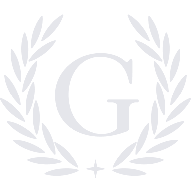A dark blue laurel wreath surrounds a large letter 'G' with a small cross below it.