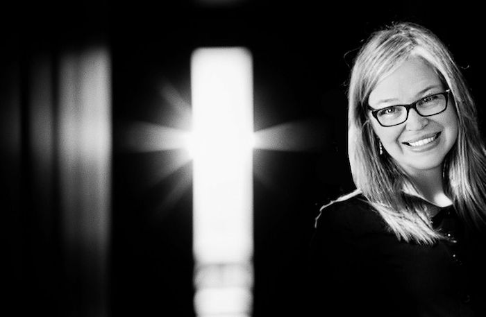 Carole Murphy standing before a bright light, symbolizing talking to the light.
