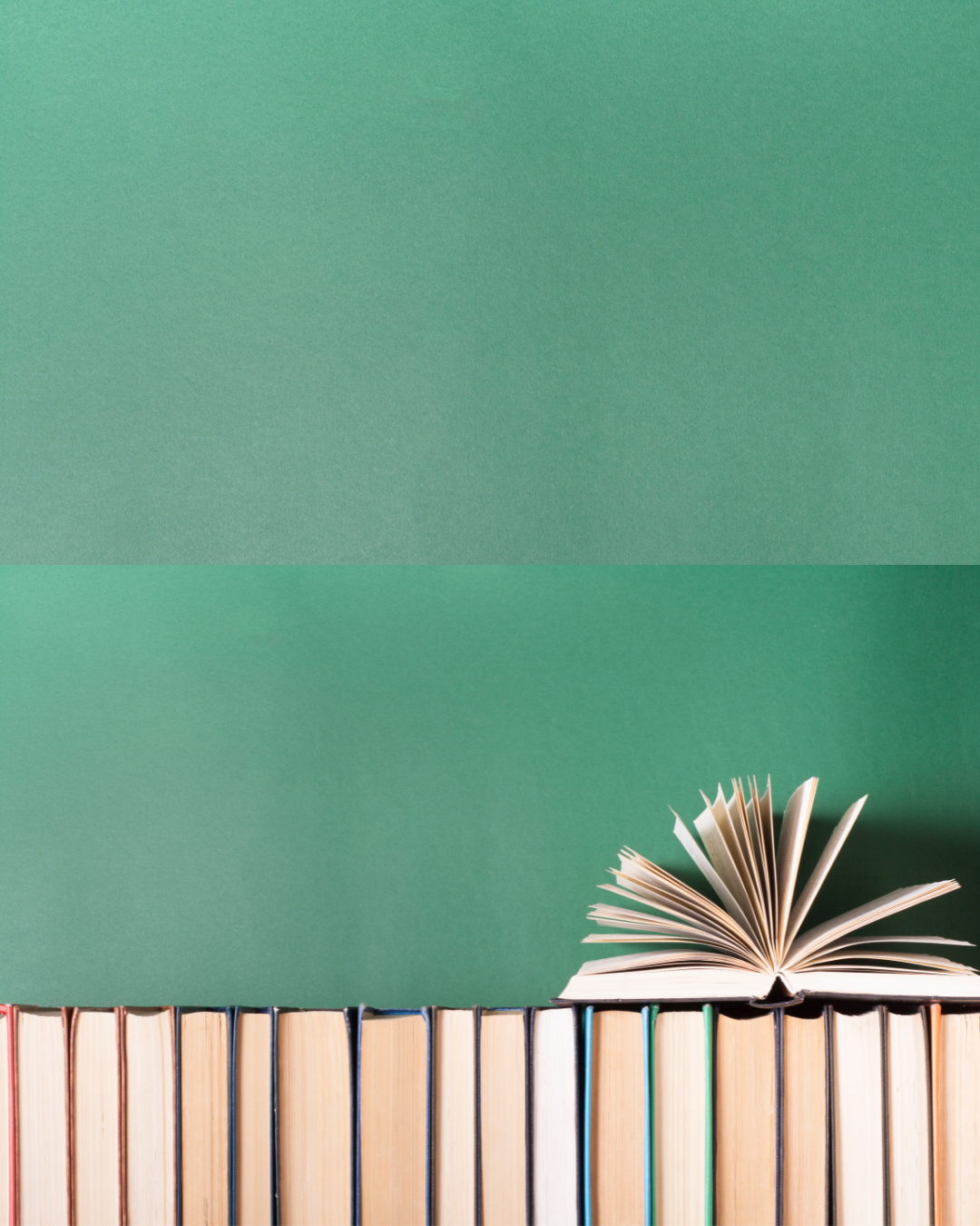 A row of books with one open book on top, set against a green background.