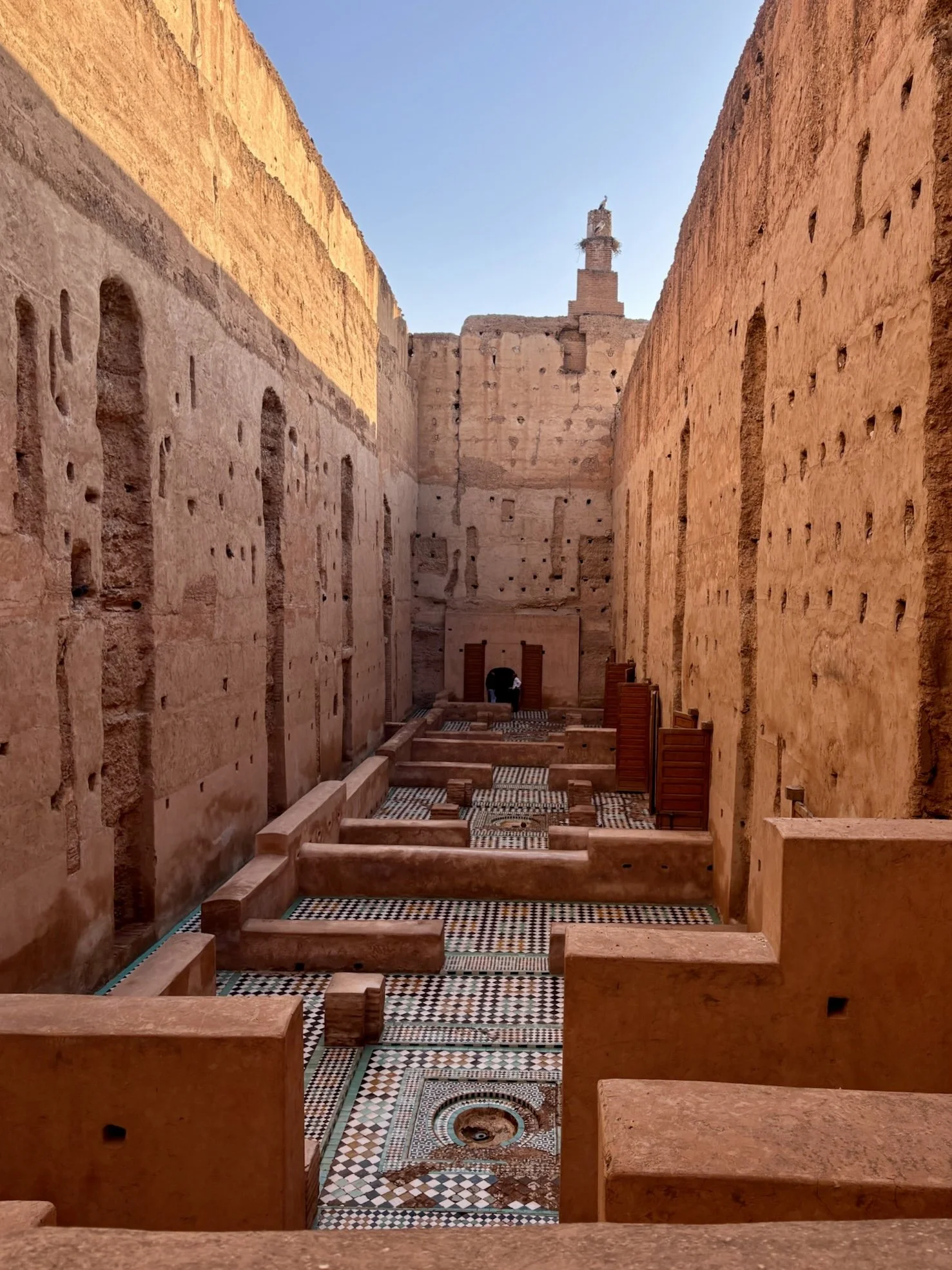 El Badi Palace in Marrakech, with historic palace walls, courtyard details, and traditional Moroccan architectural features.