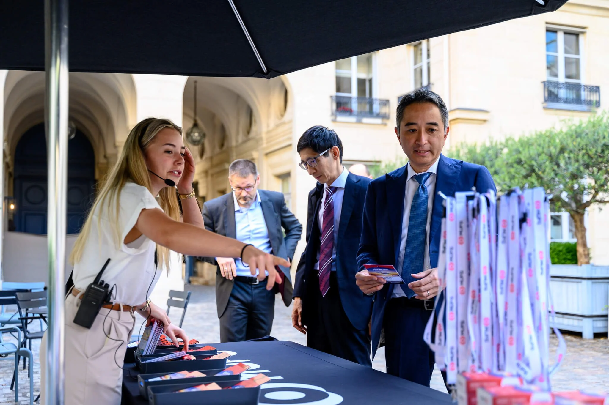 MUFG Conference registration outside an elegant Paris building.