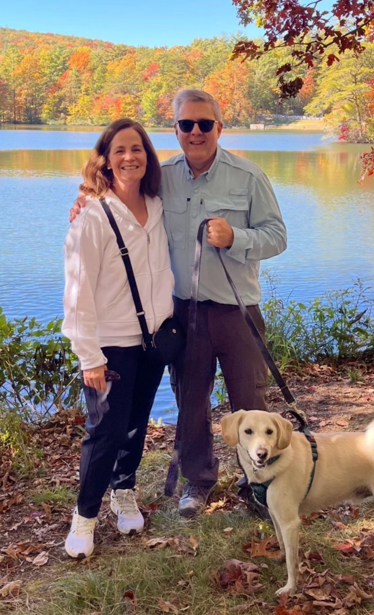 A man dressed as The Cat in the Hat holding a certificate, wearing a hat similar to the character's, with a turtle and fish in the background, likely in a children's hospital or pediatric setting.