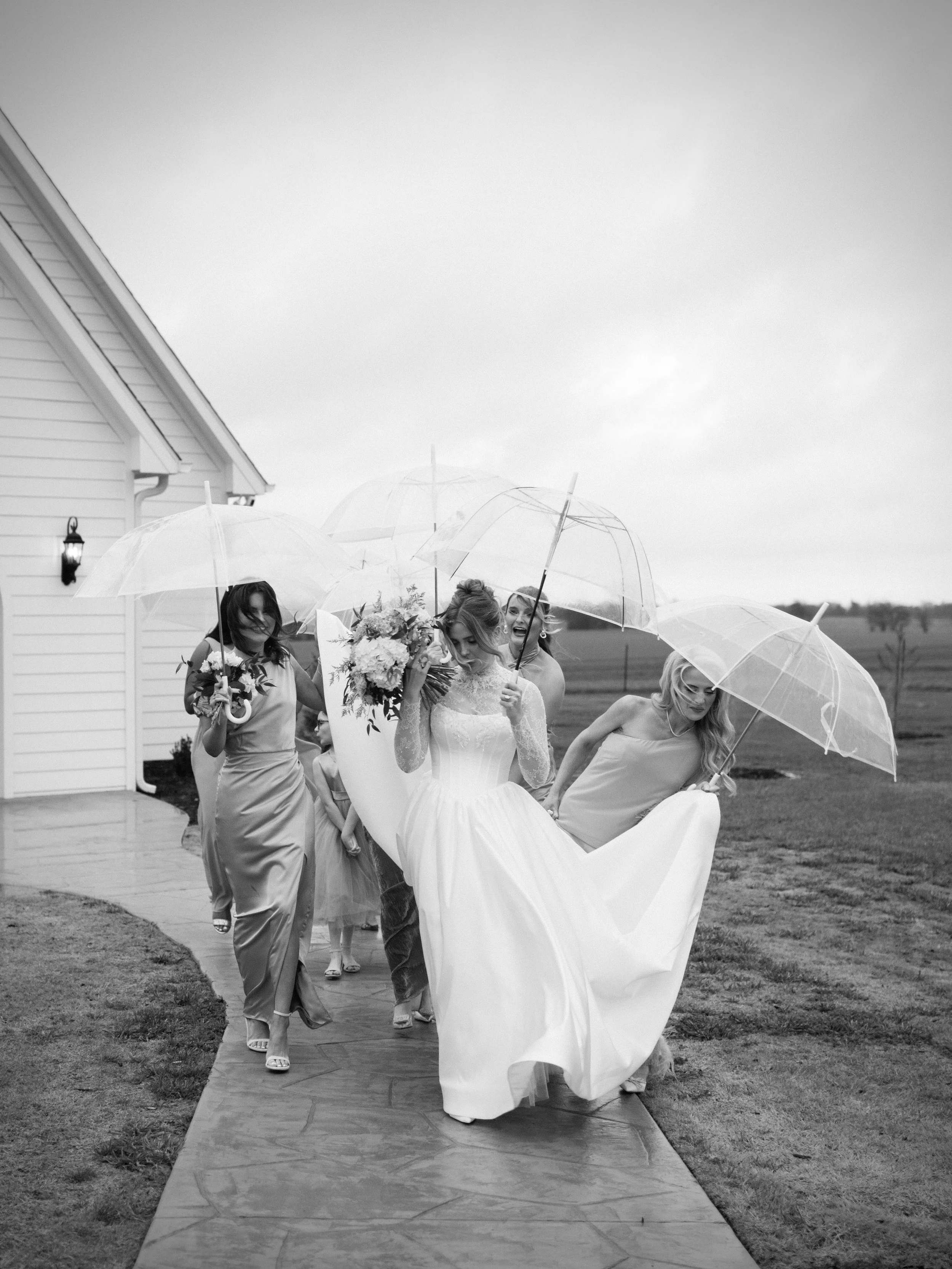 If it rains on your wedding, IT&rsquo;S OKAY. Rain made these photos happen! Gracie&rsquo;s bridesmaids wouldn&rsquo;t have needed to pick up her dress [while holding umbrellas] if not for the rain. 

These photos were taken in less than five minutes
