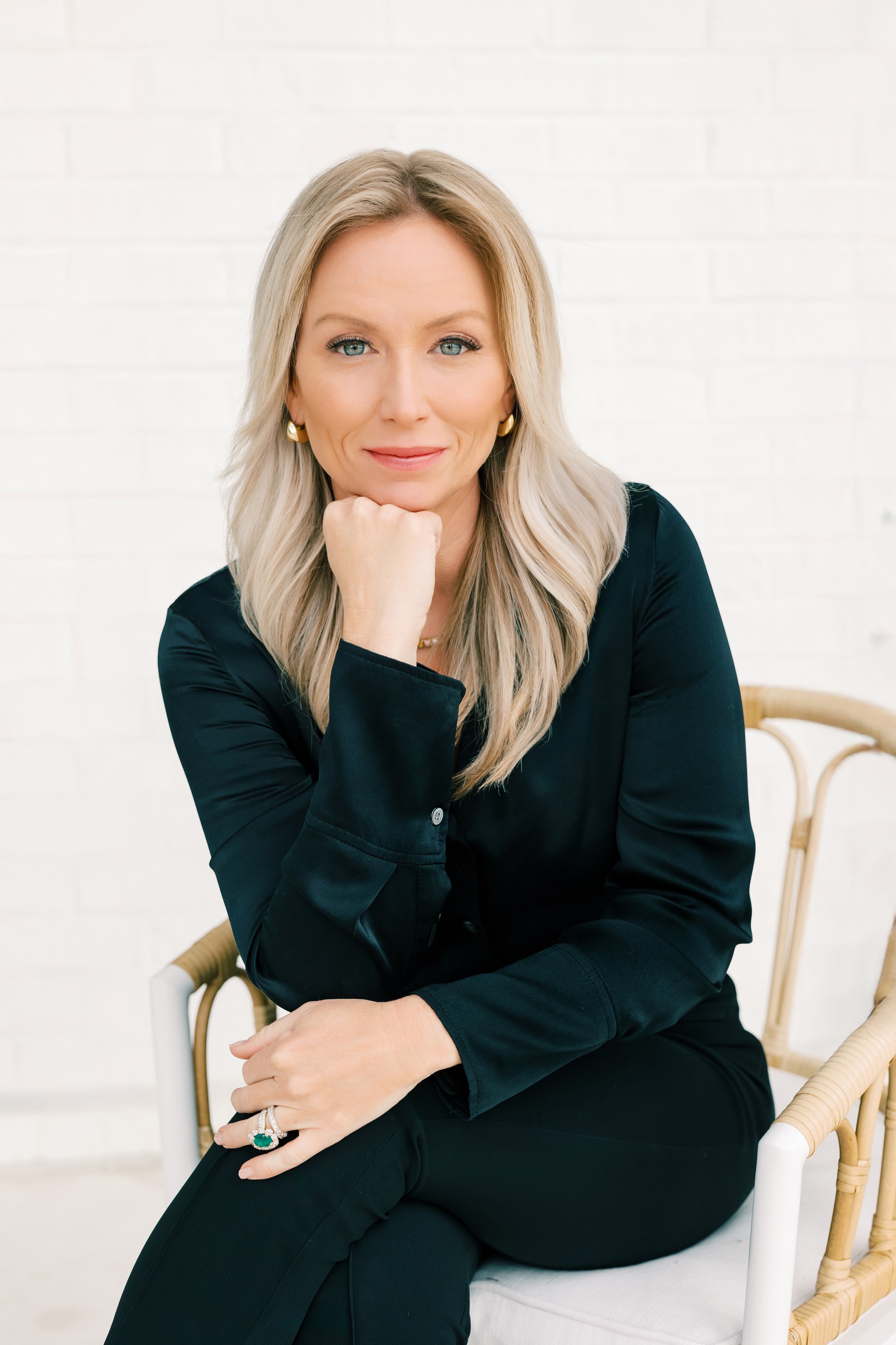 photo of jill davis with blonde hair, blue eyes and black business attire