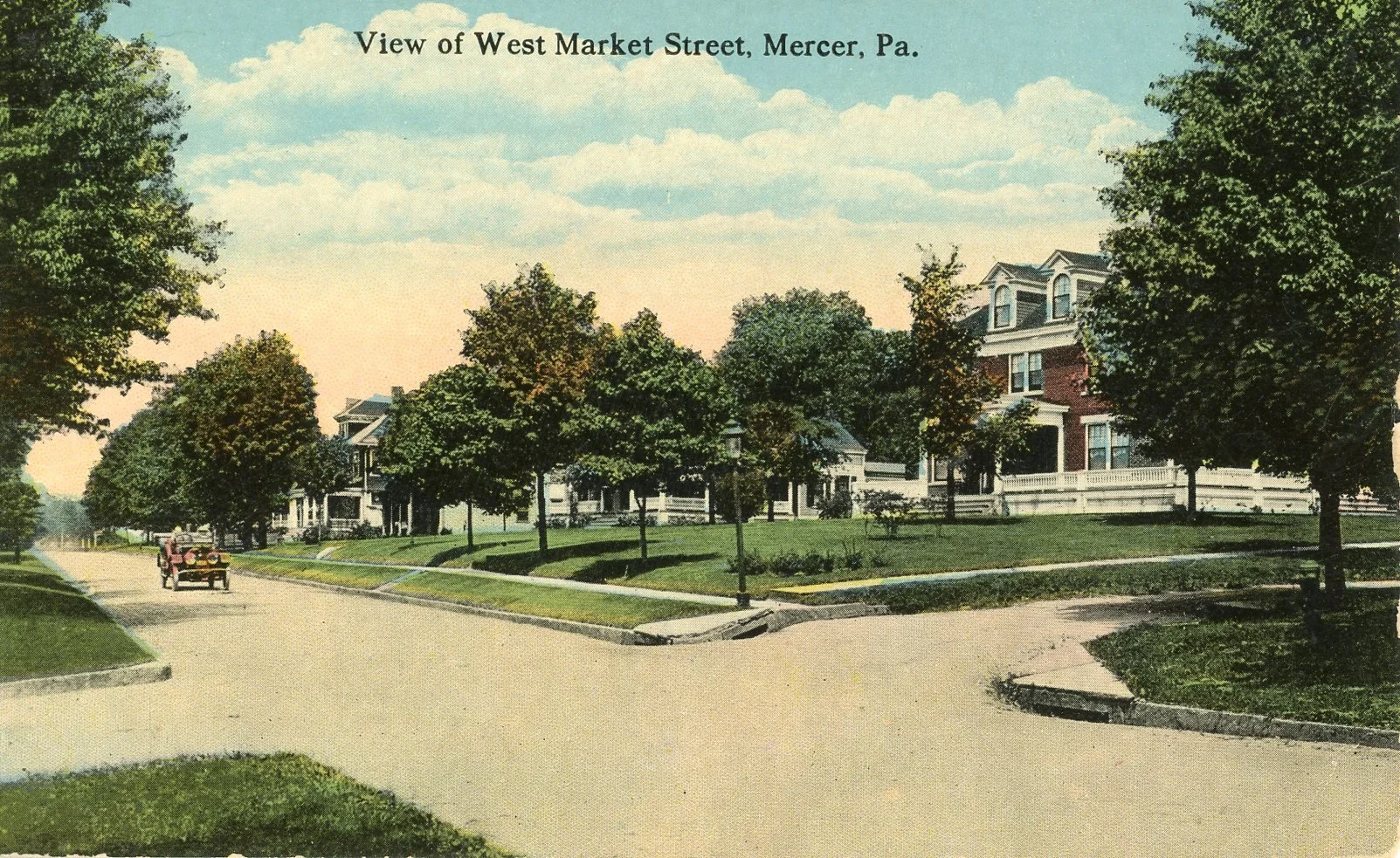 A vintage colorized postcard showing a street view of West Market Street in Mercer, Pennsylvania, with large colonial-style houses, trees lining the street, and a horse-drawn carriage on the road.