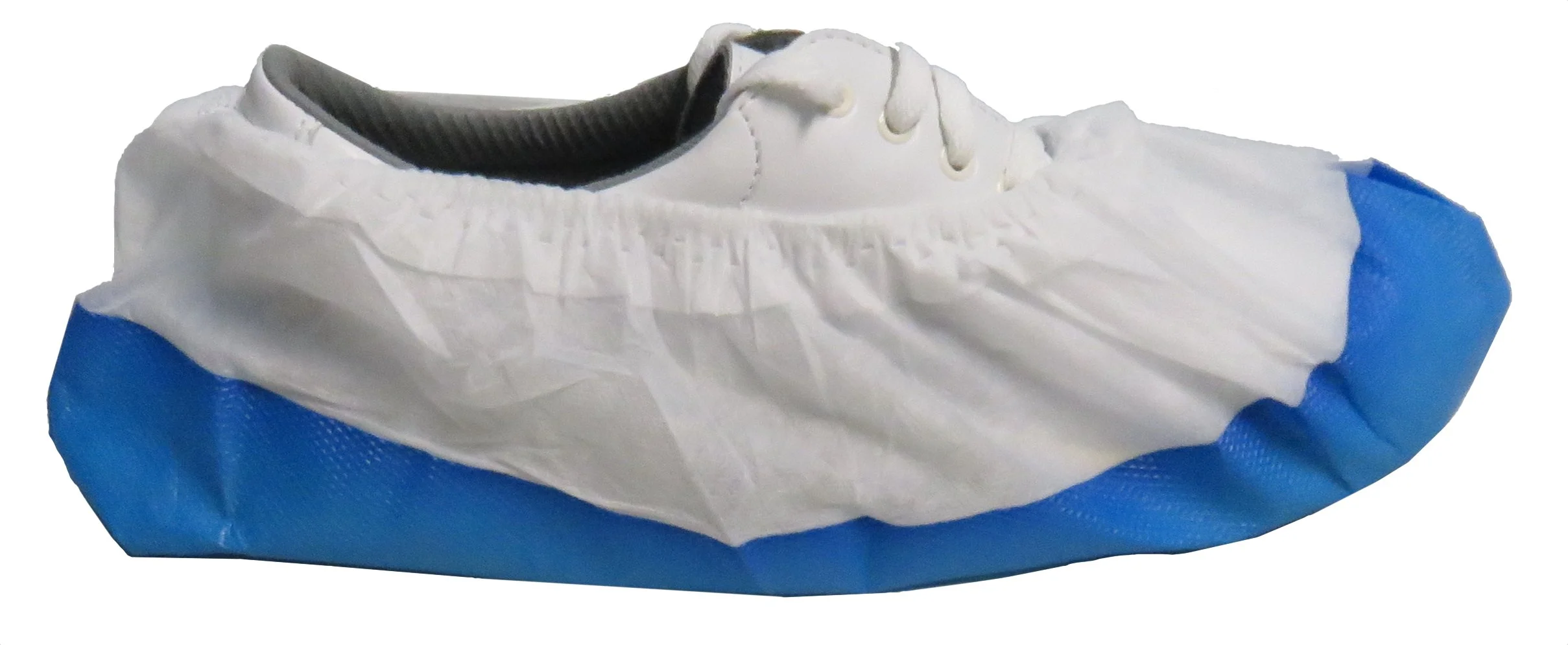 Disposable shoe cover over a white slip-on shoe with gray interior lining.