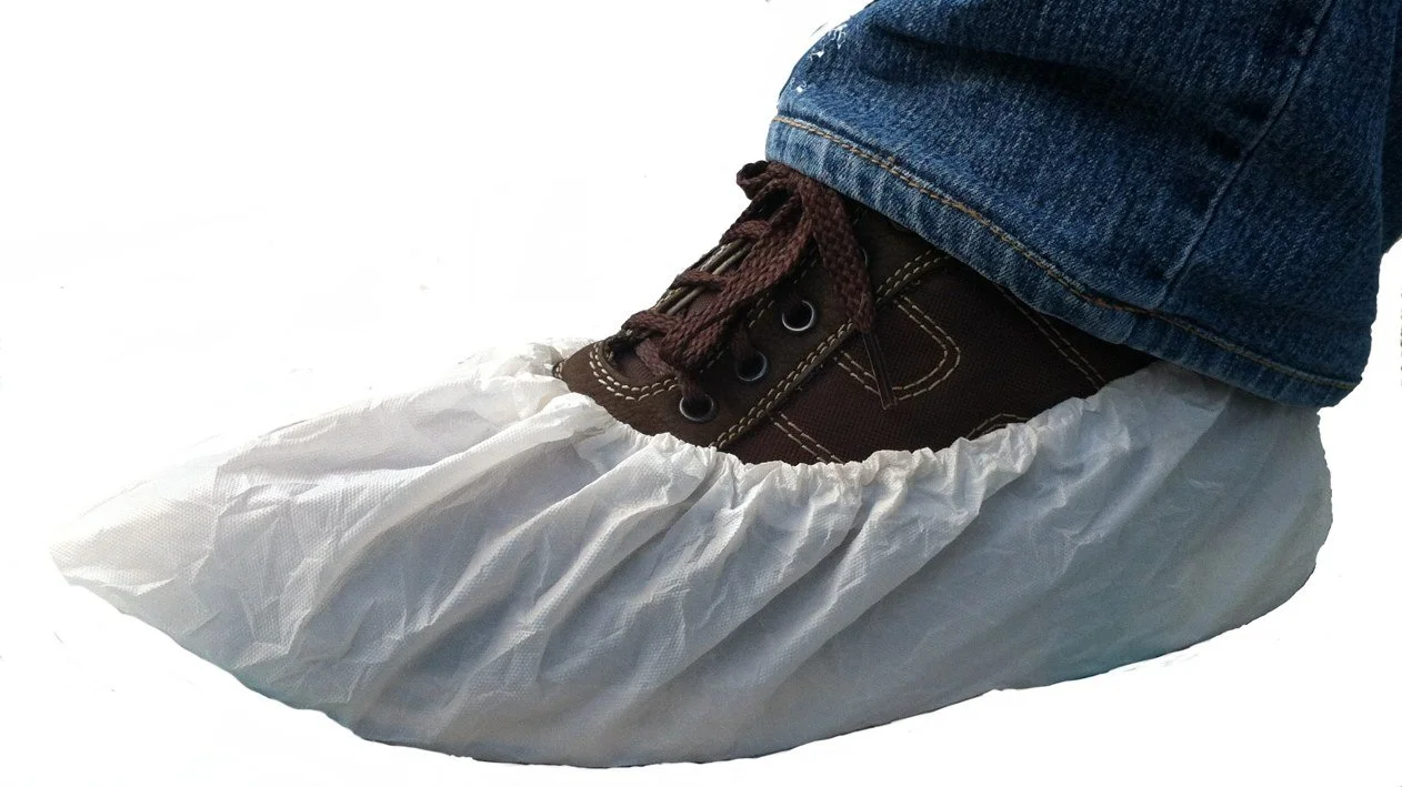 Close-up of a white disposable surgical mask.