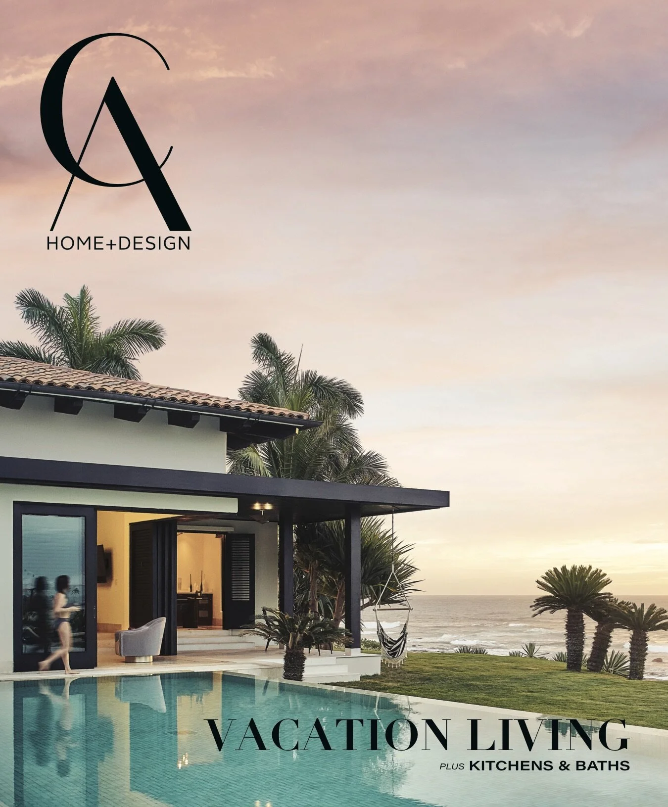 Cover image of a magazine titled 'Home + Design' featuring a luxurious vacation home with a pool, palm trees, and ocean view at sunset, with the words 'Vacation Living' and 'Plus Kitchens & Baths'