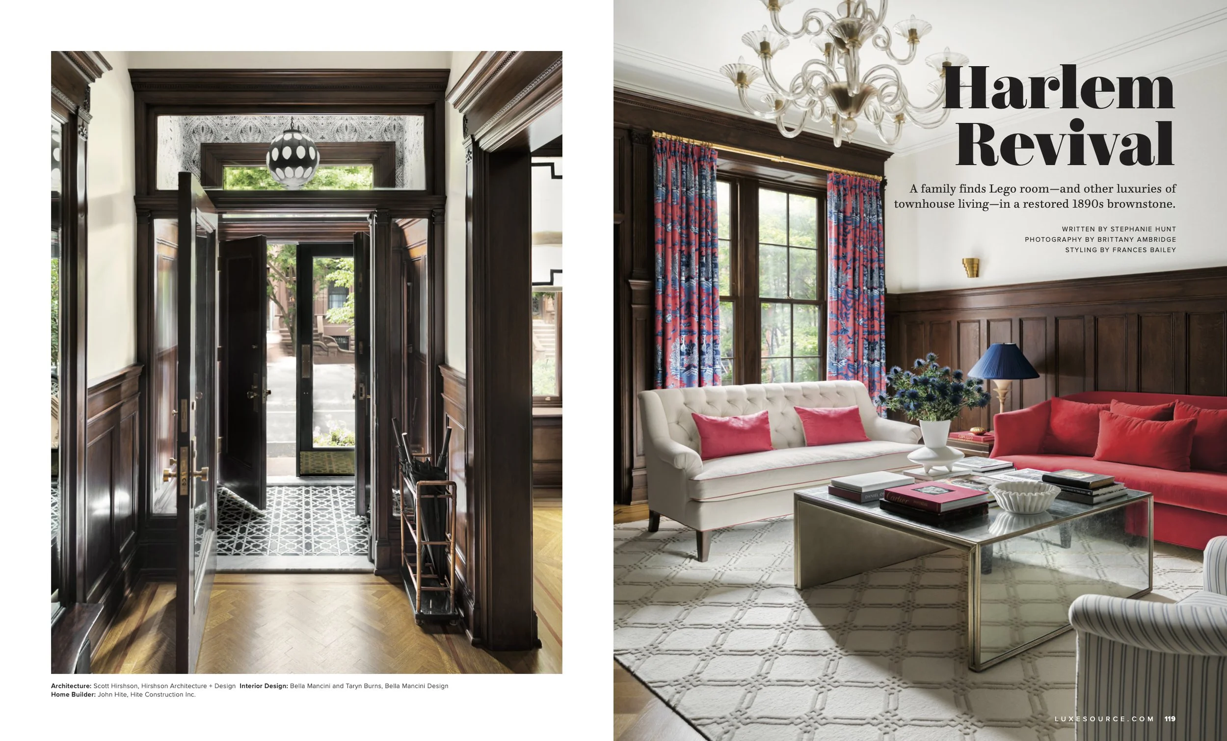 Interior of a vintage living room with dark wood paneling, a white tufted sofa with pink cushions, red sofas, a glass coffee table, and a large window with floral curtains; a white chandelier hangs from the ceiling.
