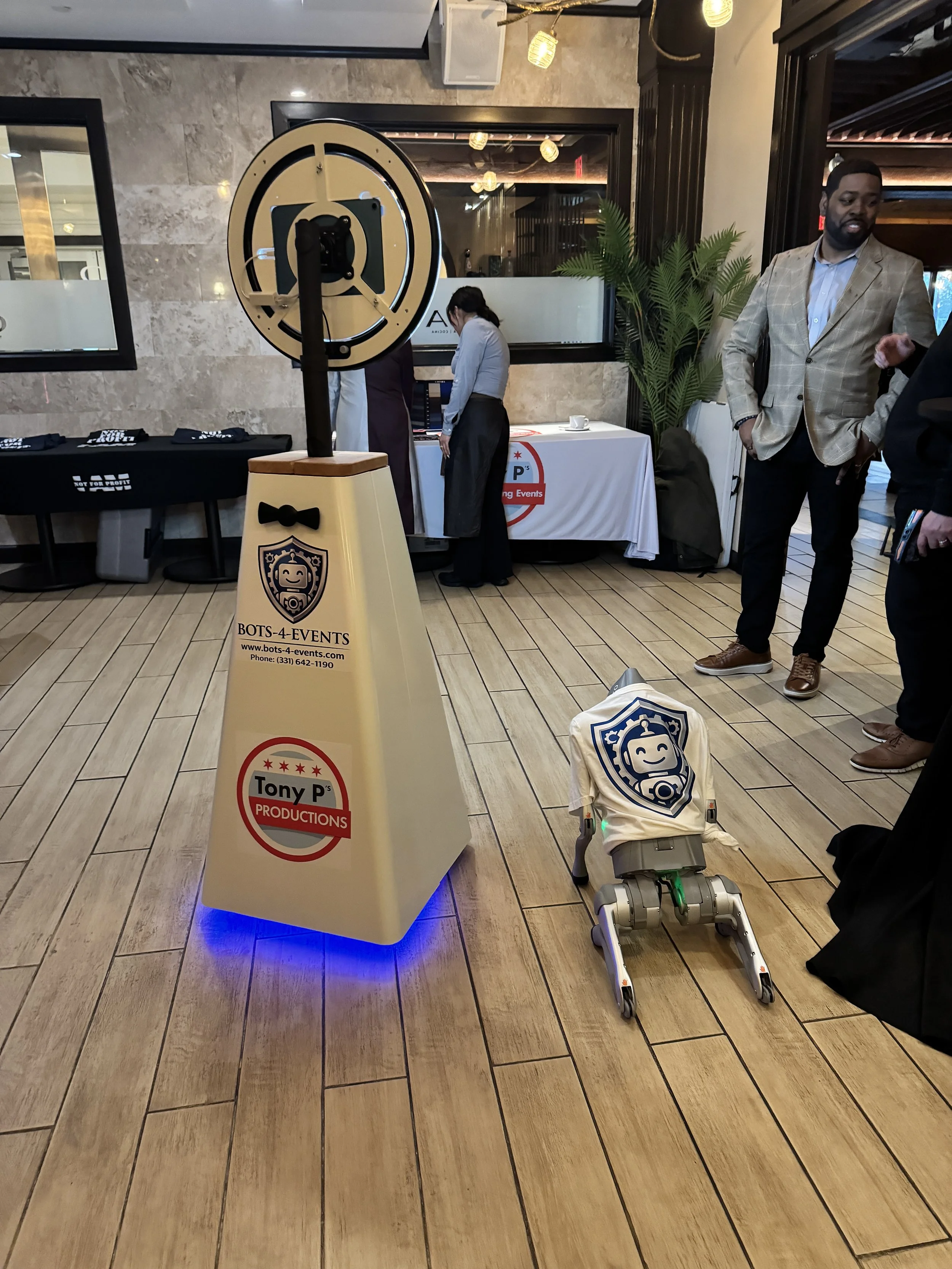 Selfiebot and Robodog Posing and waiting to entertain attendees at a networking event