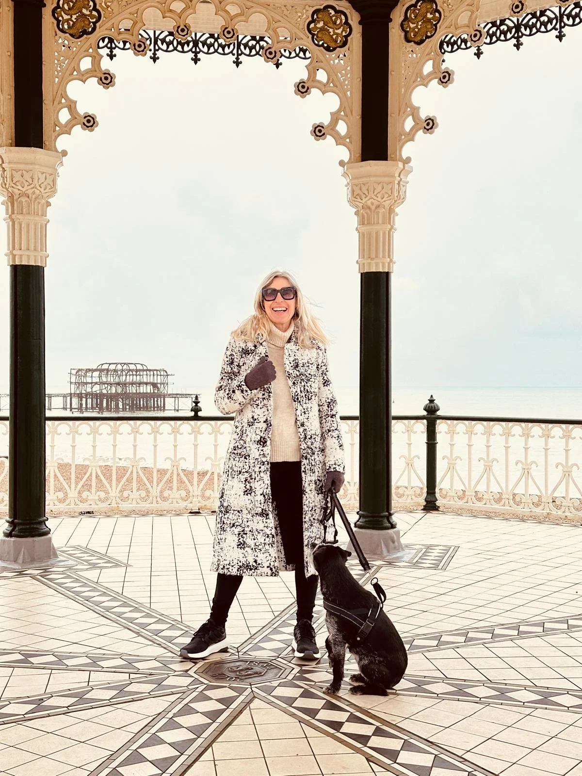 Celebrant with her dog in Brighton , smiling 