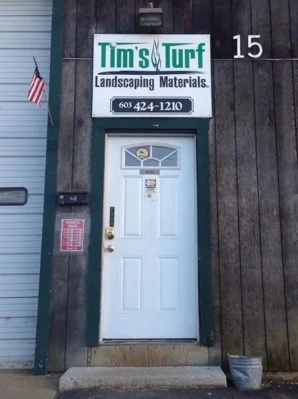 Business sign above entrance door to the office