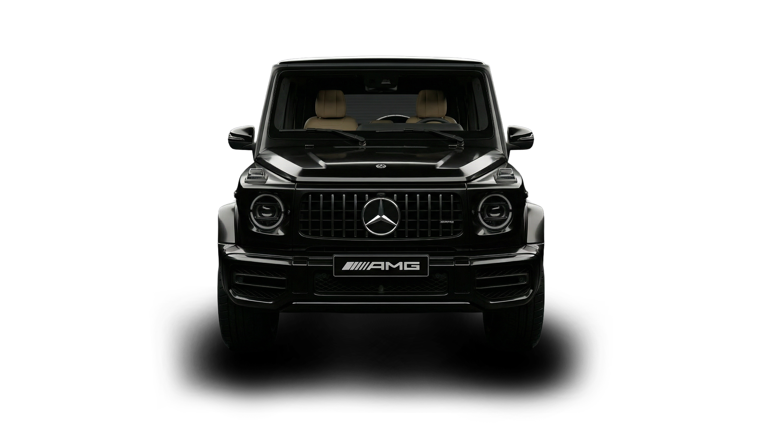 Front view of a black Mercedes-Benz G-Class SUV with AMG badge, beige interior seats visible through the windshield, against a black background.