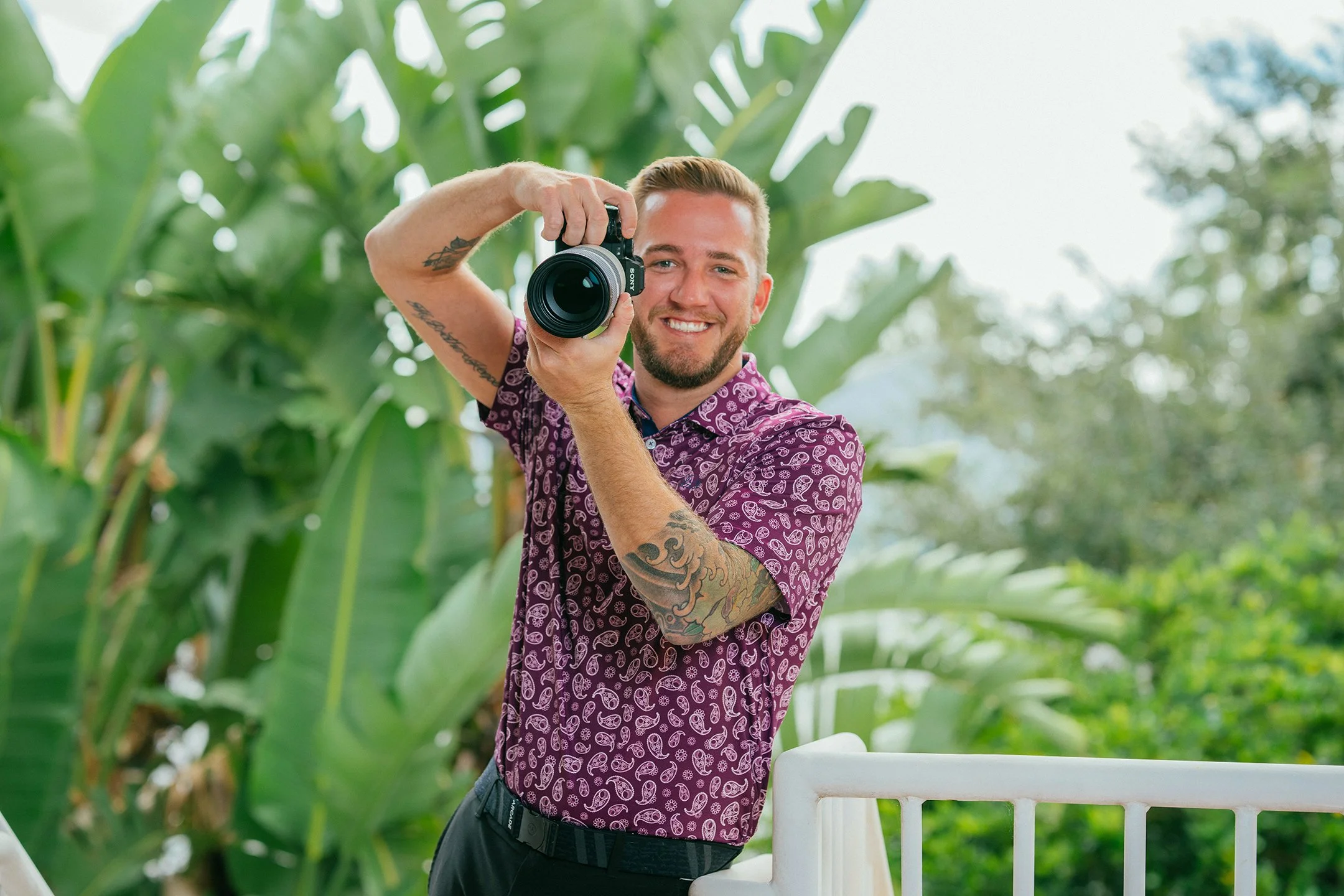 Ryan Edwards photographer standing outside with camera
