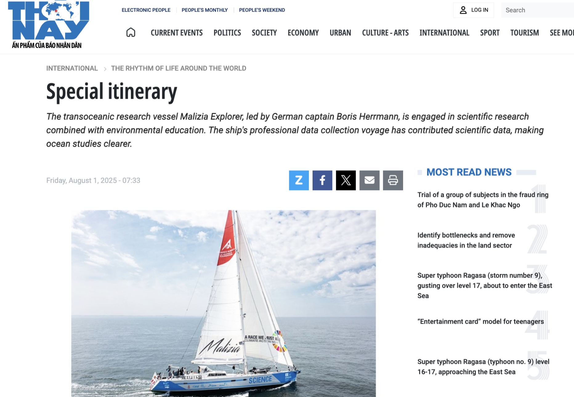 A research vessel sailing on the ocean with a sky filled with scattered clouds, displaying a red and white sail with a logo, advertising environmental action and science.