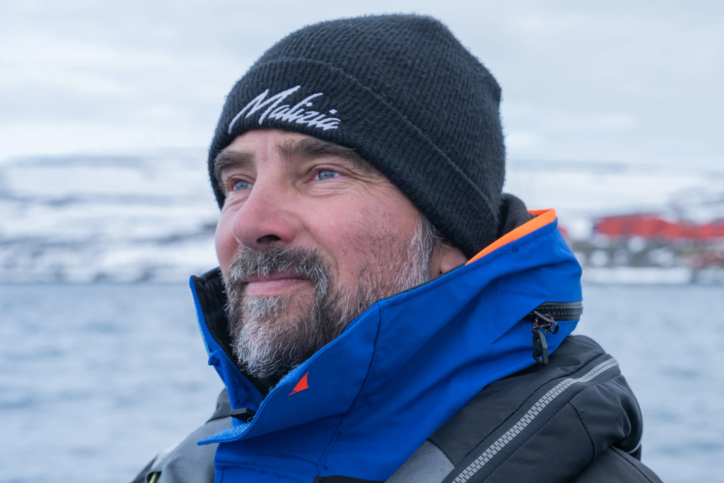 Boris Herrmann, founder of the research vessel Malizia Explorer standing on the boat in Antarctica.