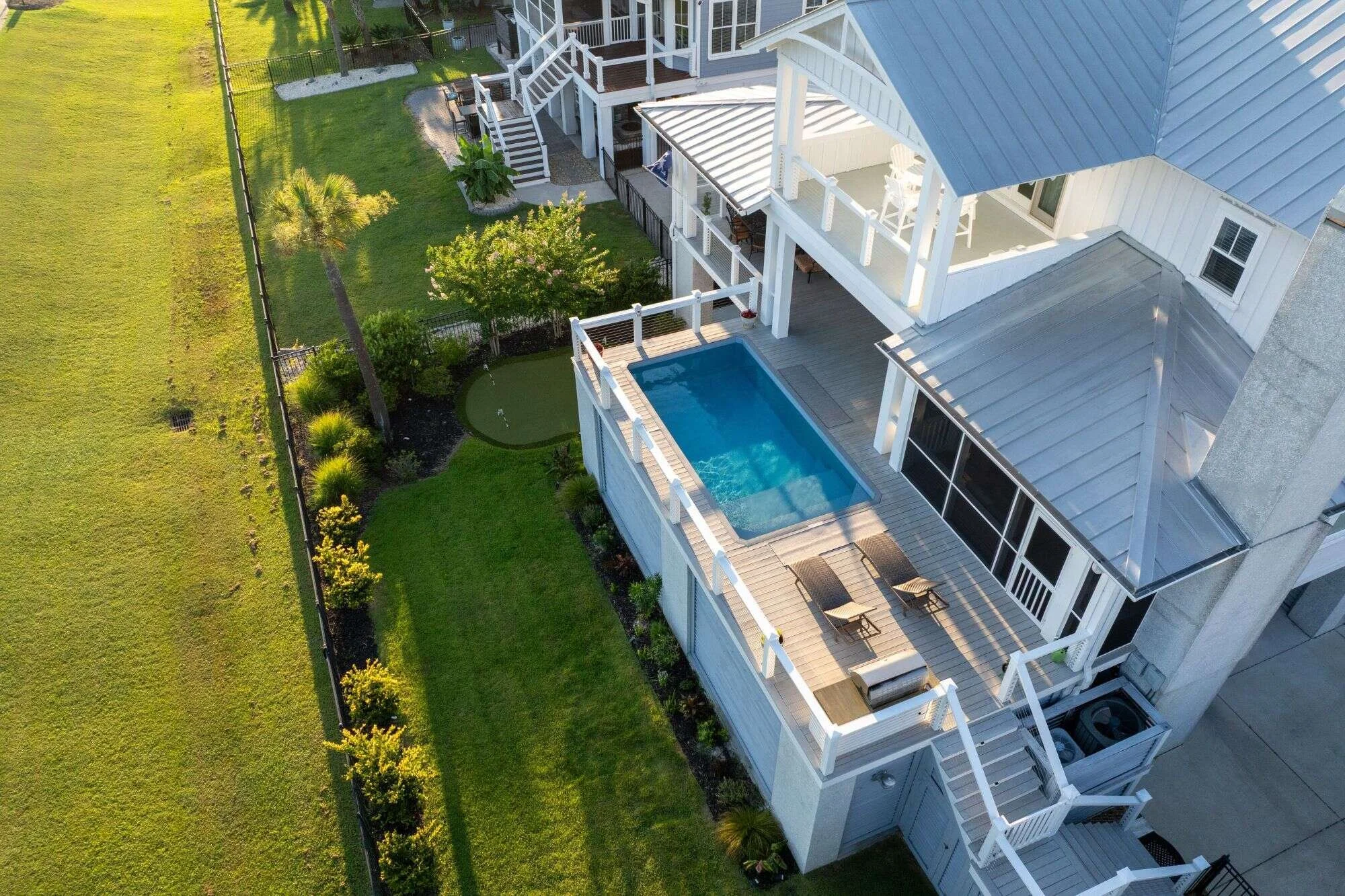 Aerial view of Plungie plunge pool installation in Chesterfield Missouri on custom deck outdoor living space