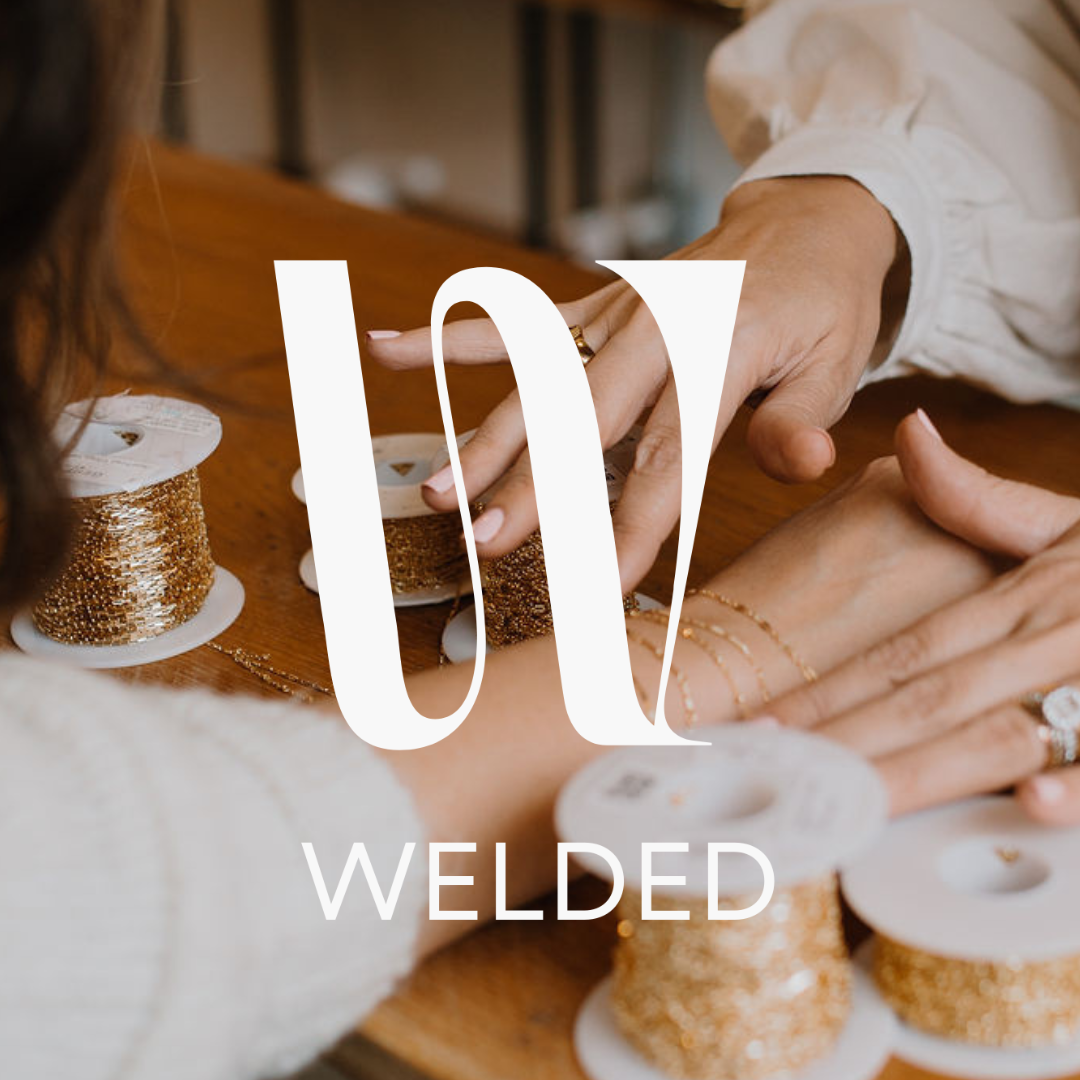 person from WELDED welding a custom piece of permanent Jewelry