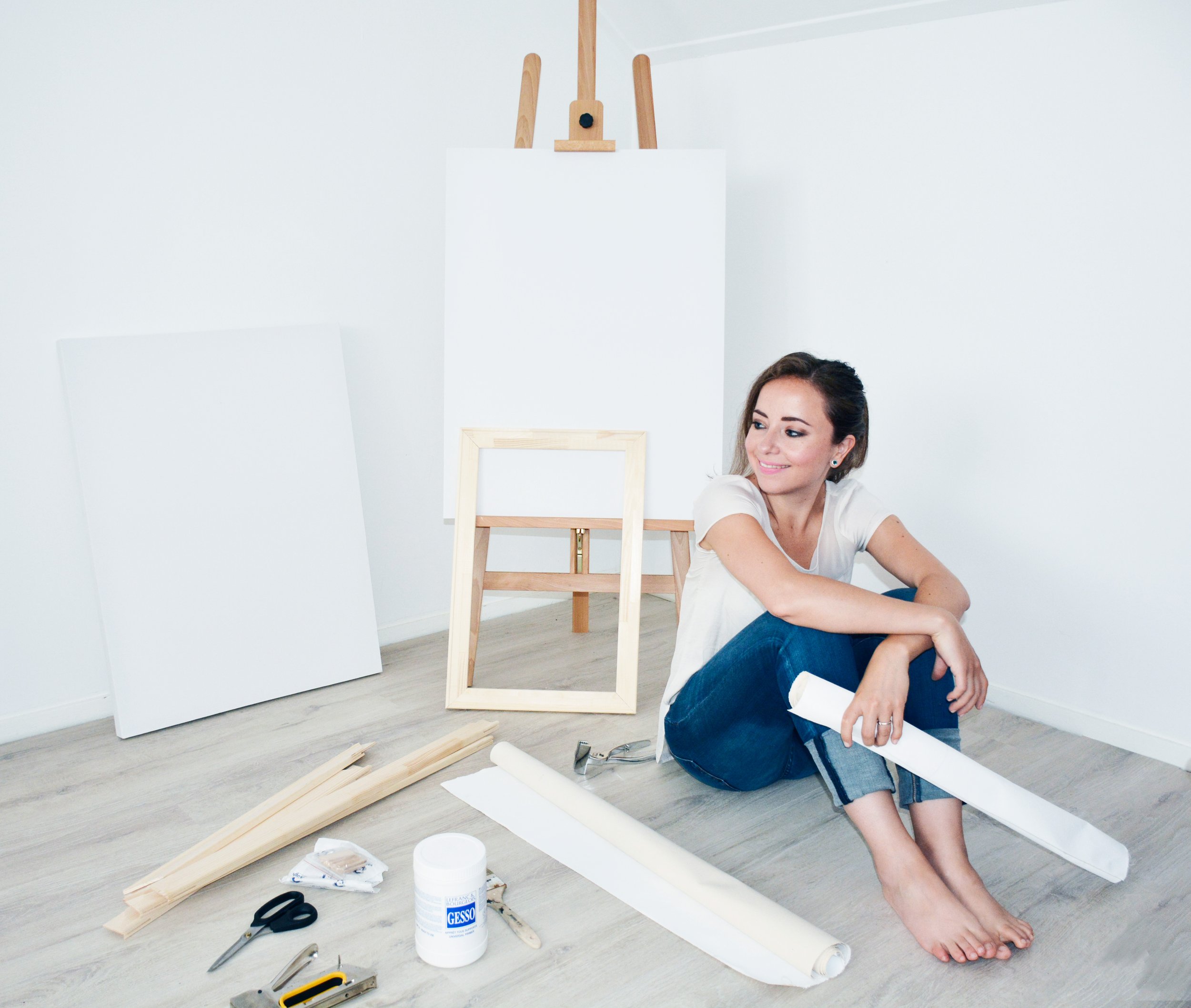 Elena san pietrini artist at her studio with easels