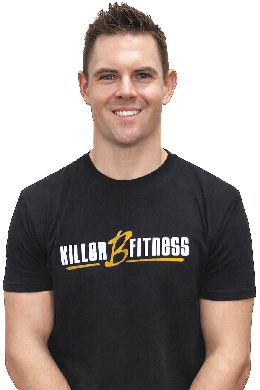 A man with short brown hair, smiling, wearing a black T-shirt with the words 'Killer B Fitness' written on it.