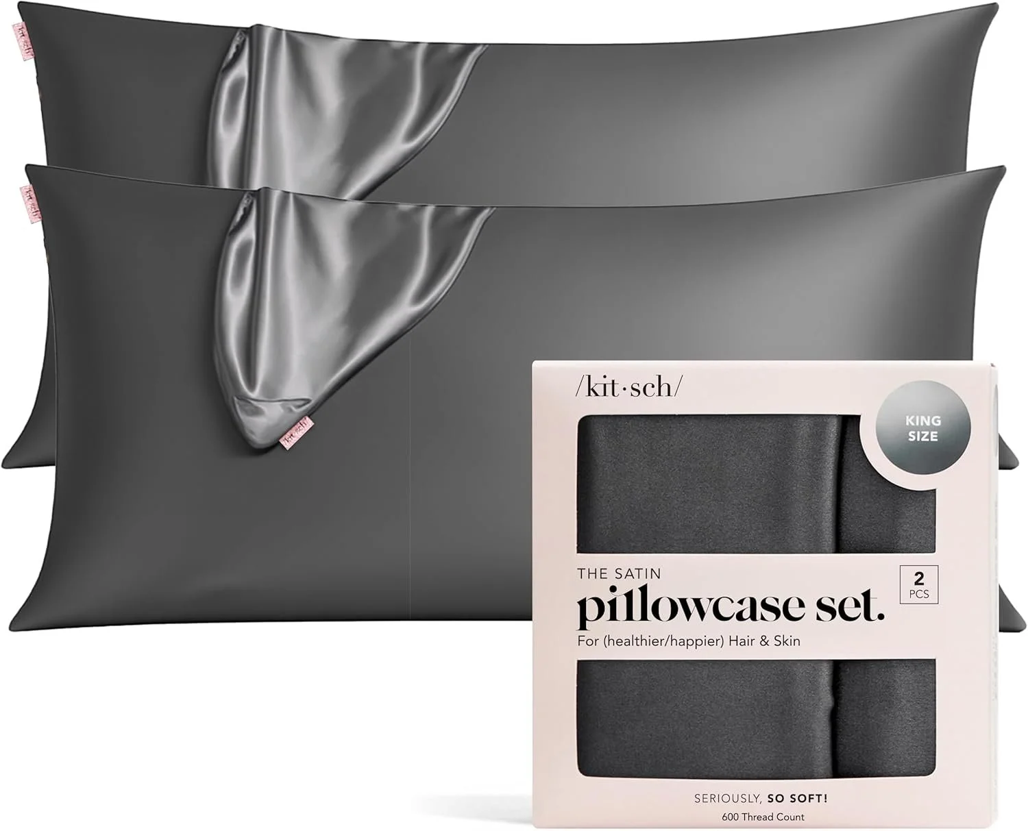 Two grey satin pillowcases and a package labeled 'The Satin Pillowcase Set' with two pillowcases inside.