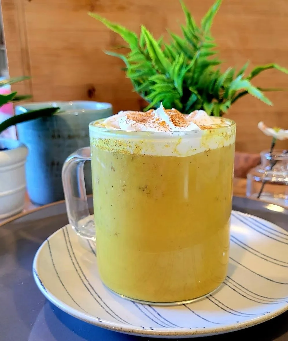 Golden milk latte with turmeric and spices in warm creamy drink