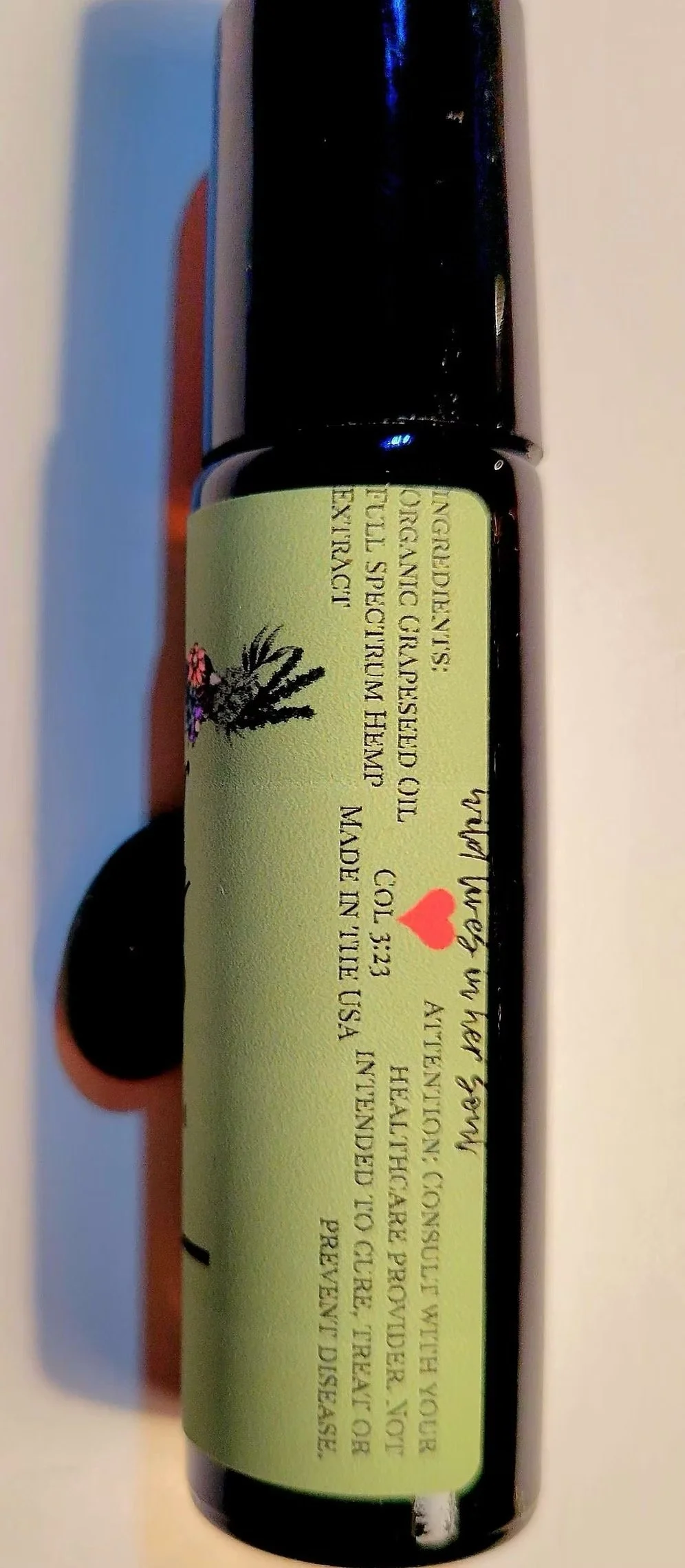 Sailor Mercy CBD rollerball packaging detail showing full spectrum hemp product