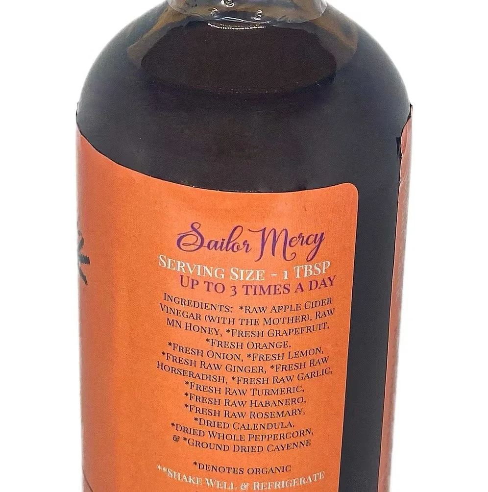 Close-up of fire cider bottle label showing ingredients and herbal tonic details