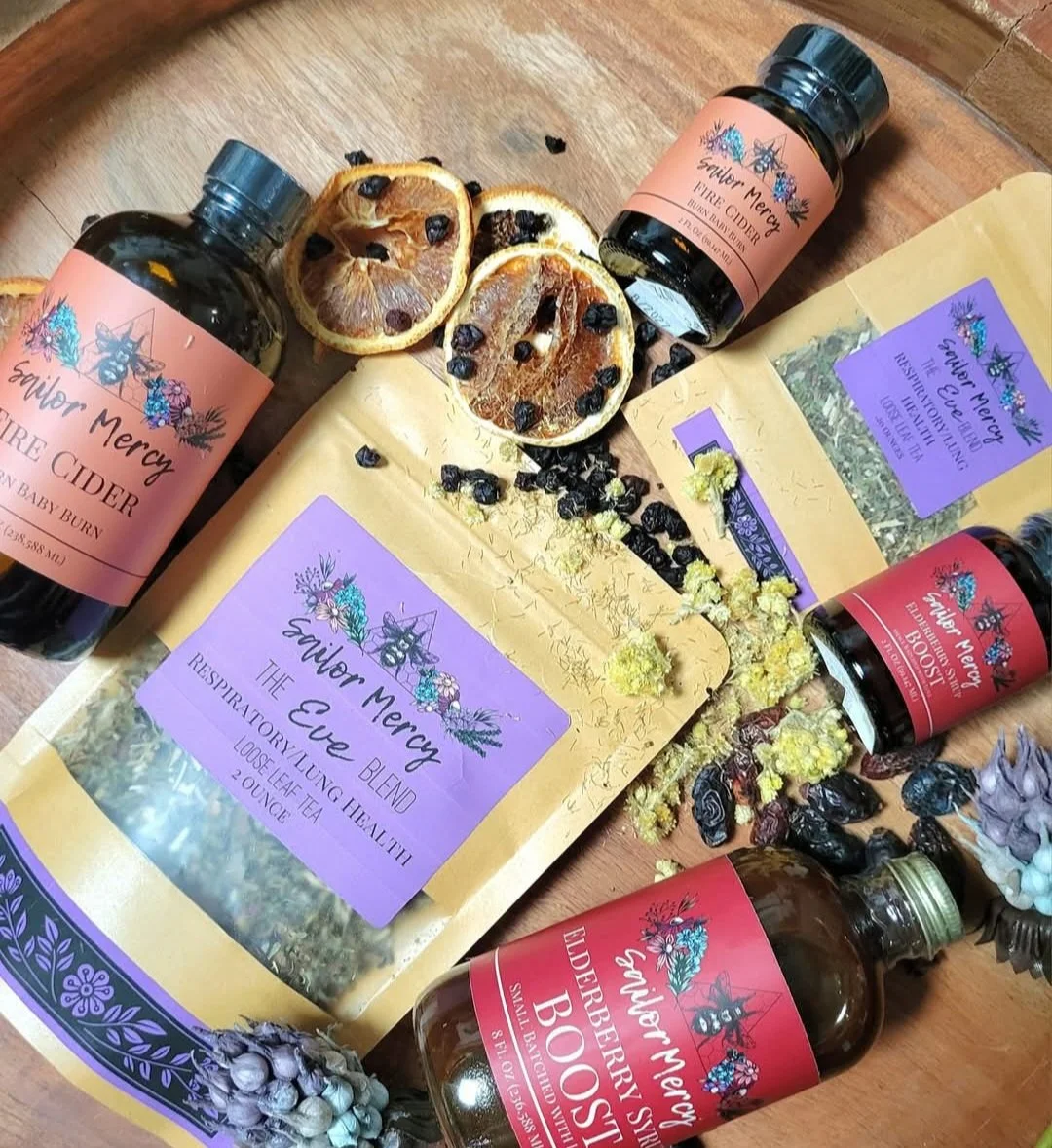 Sailor Mercy wellness products featuring Fire Cider, Tea, Elderberry product
